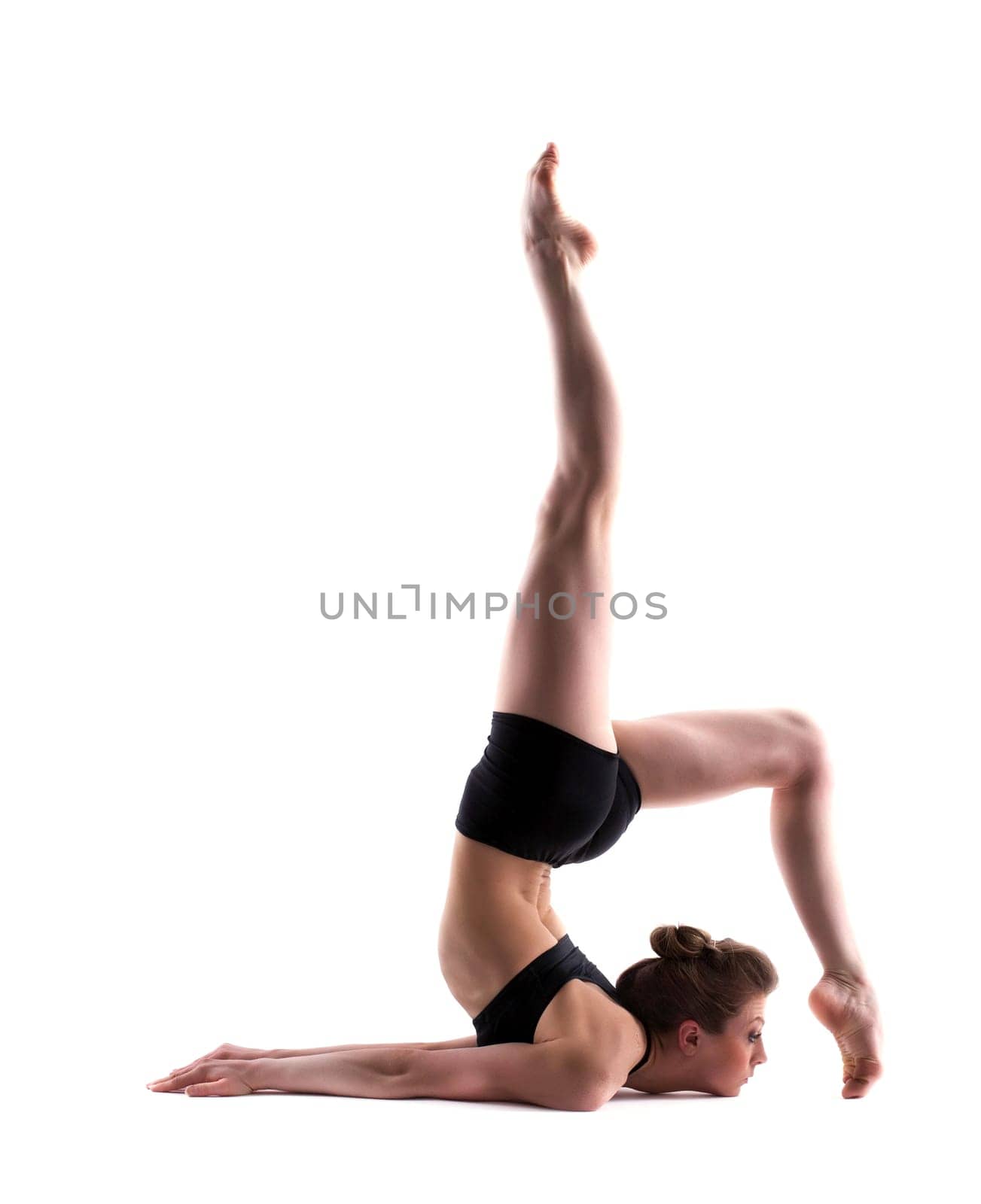 Image of young graceful gymnast isolated on white