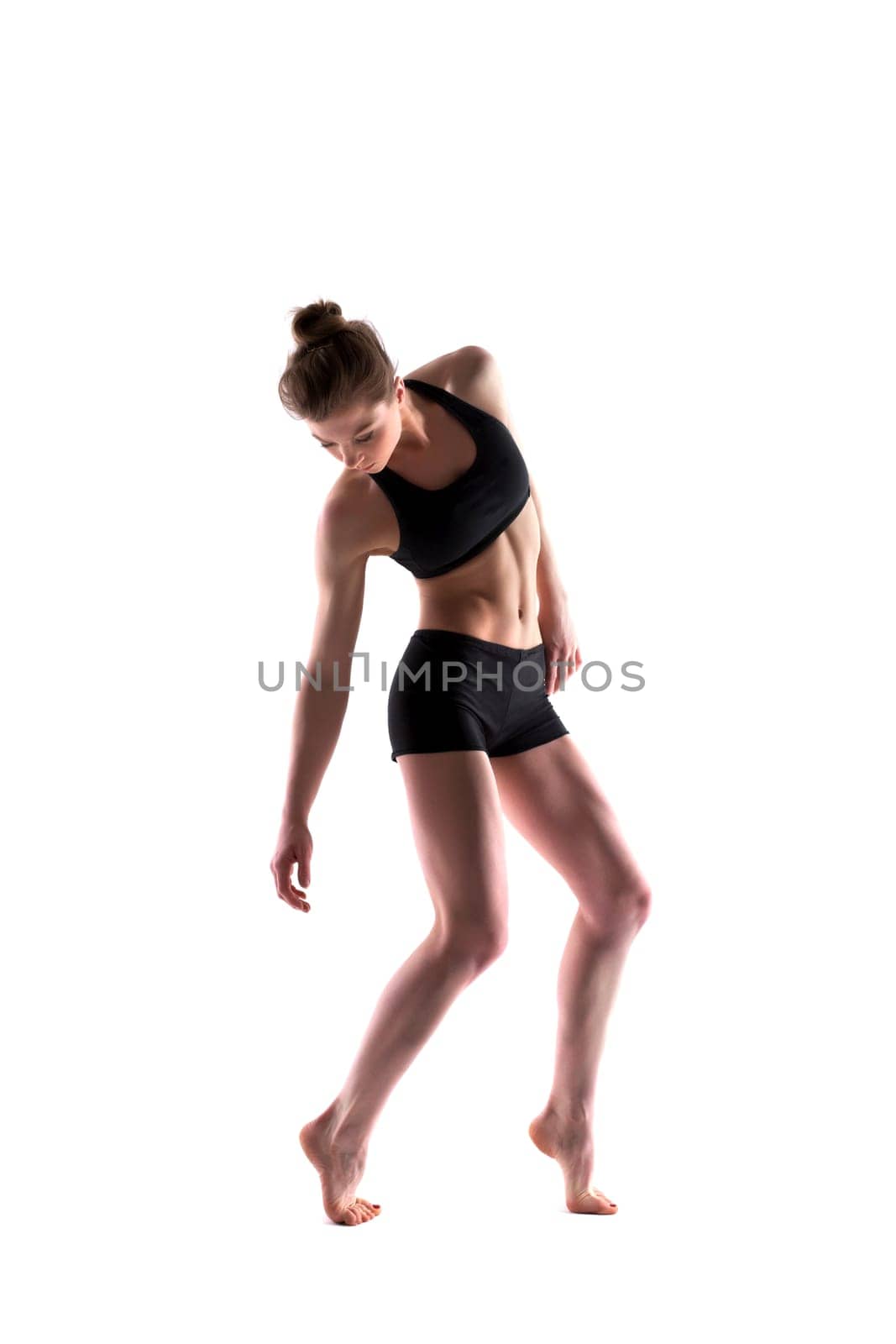 Image of pretty slim woman posing in studio, isolated on white