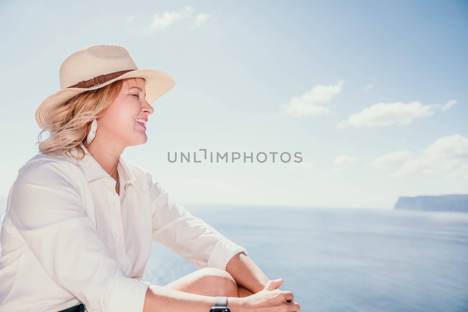 Happy girl doing yoga with laptop working at the beach. beautiful and calm business woman sitting with a laptop in a summer cafe in the lotus position meditating and relaxing. freelance girl remote work beach paradise