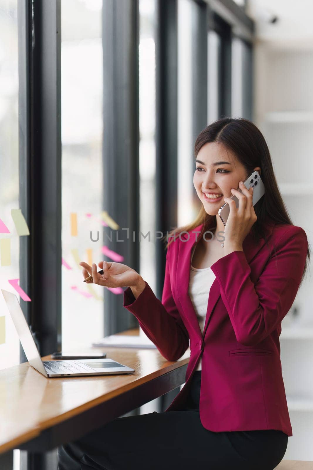 Beautiful business woman talking on the mobile phone. Management, planning and networking phone call concept.