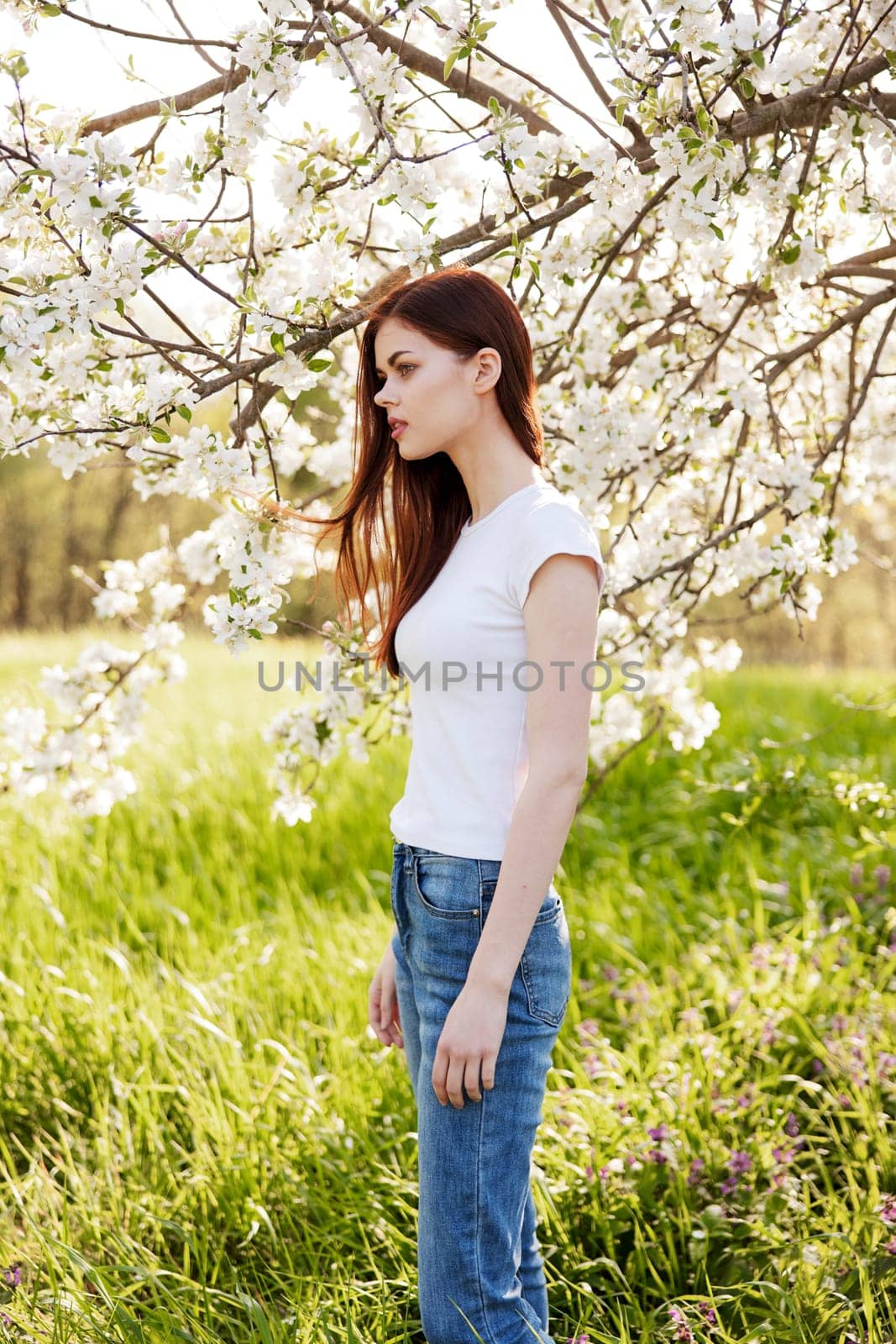 Young woman with cherry flowers portrait. High quality photo