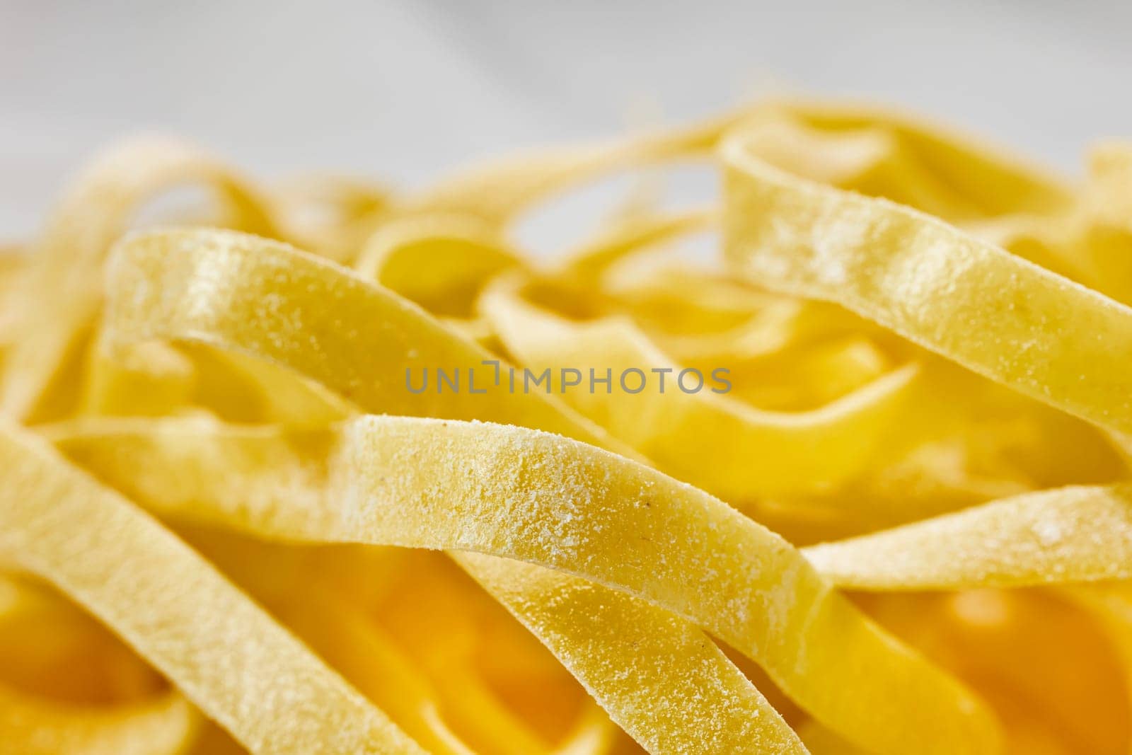 Raw fettuccine pasta detail by victimewalker