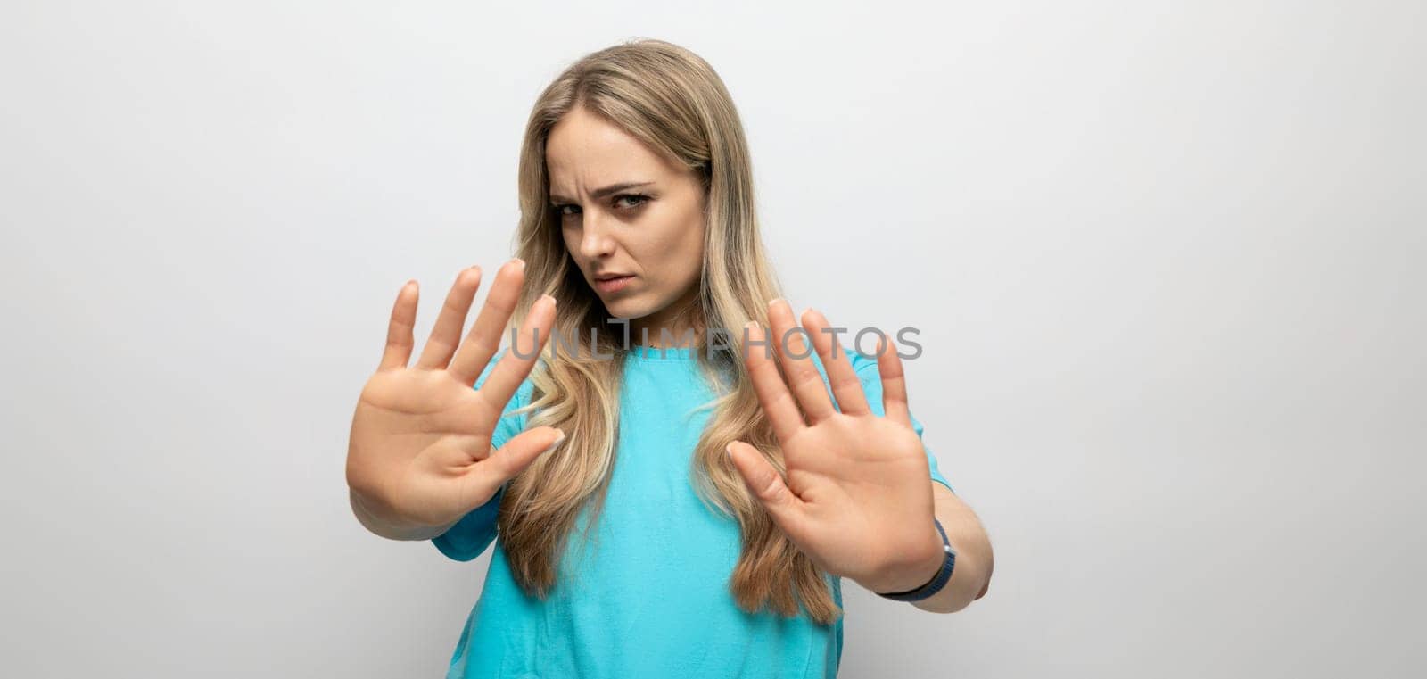european girl waving her hands on a white background.