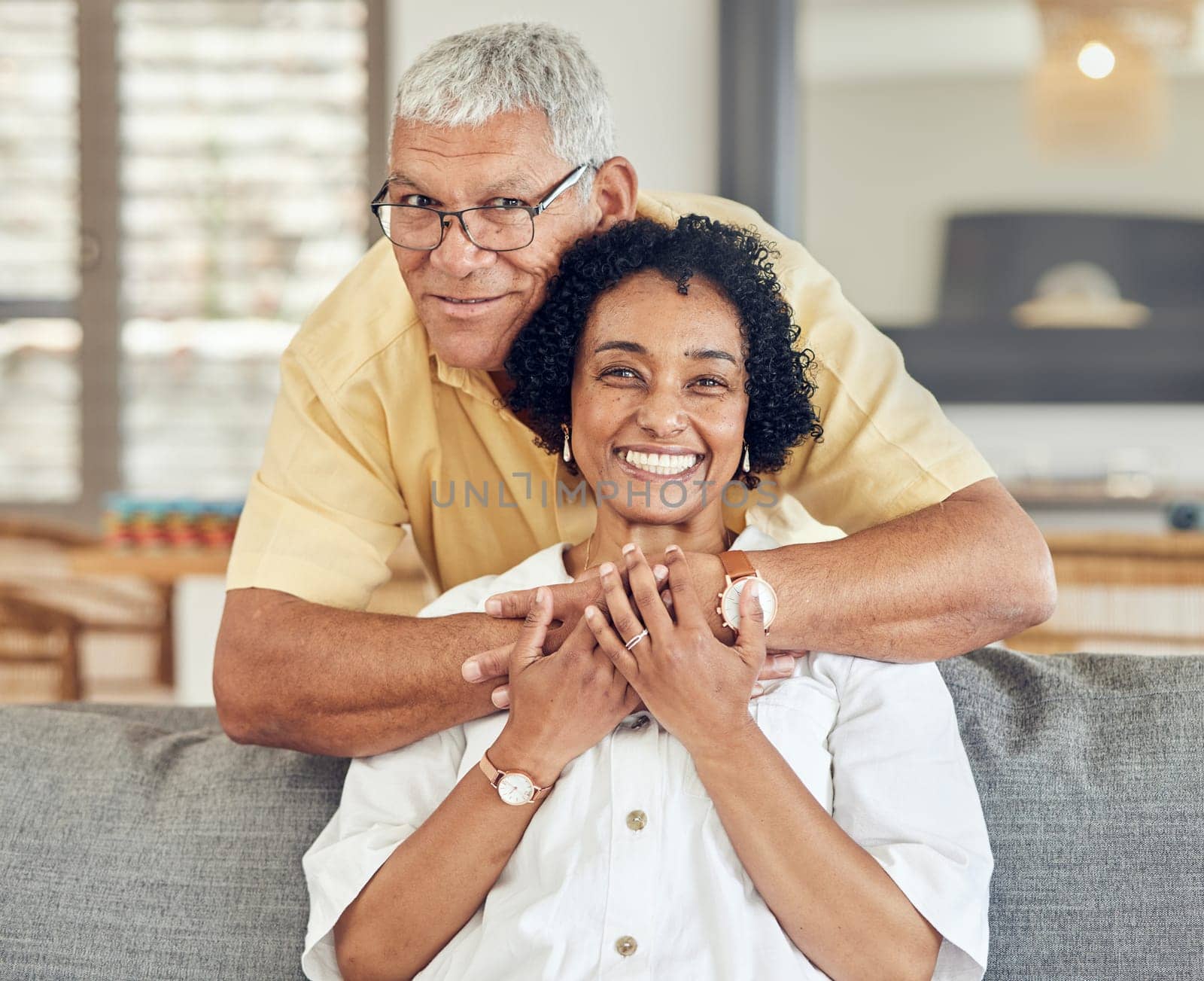 Portrait, relax and senior happy couple hug, care and enjoy quality time together on home living room sofa. Retirement happiness, marriage love bond and romantic elderly husband, wife or people smile.