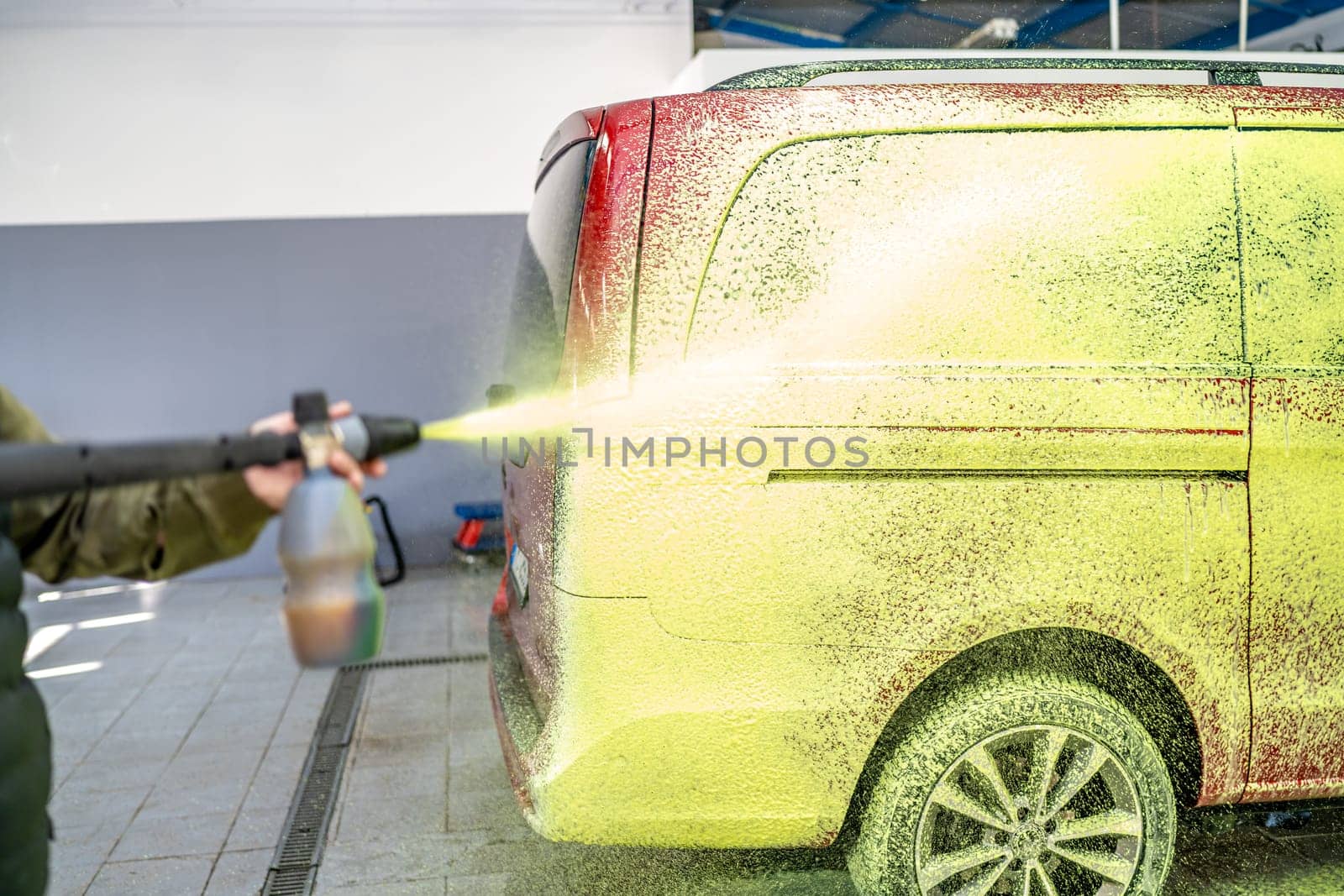 wash cars with green active foam in the garage. High quality photo