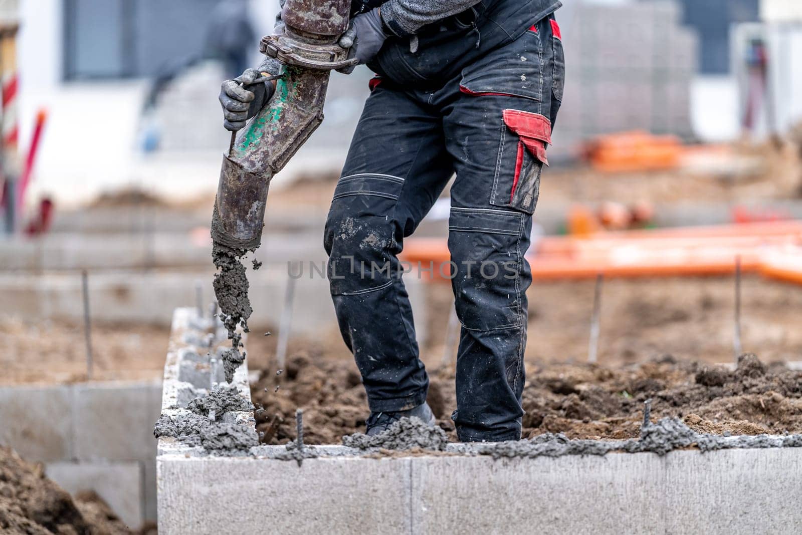 concreting the foundation of the house from the lost formwork.