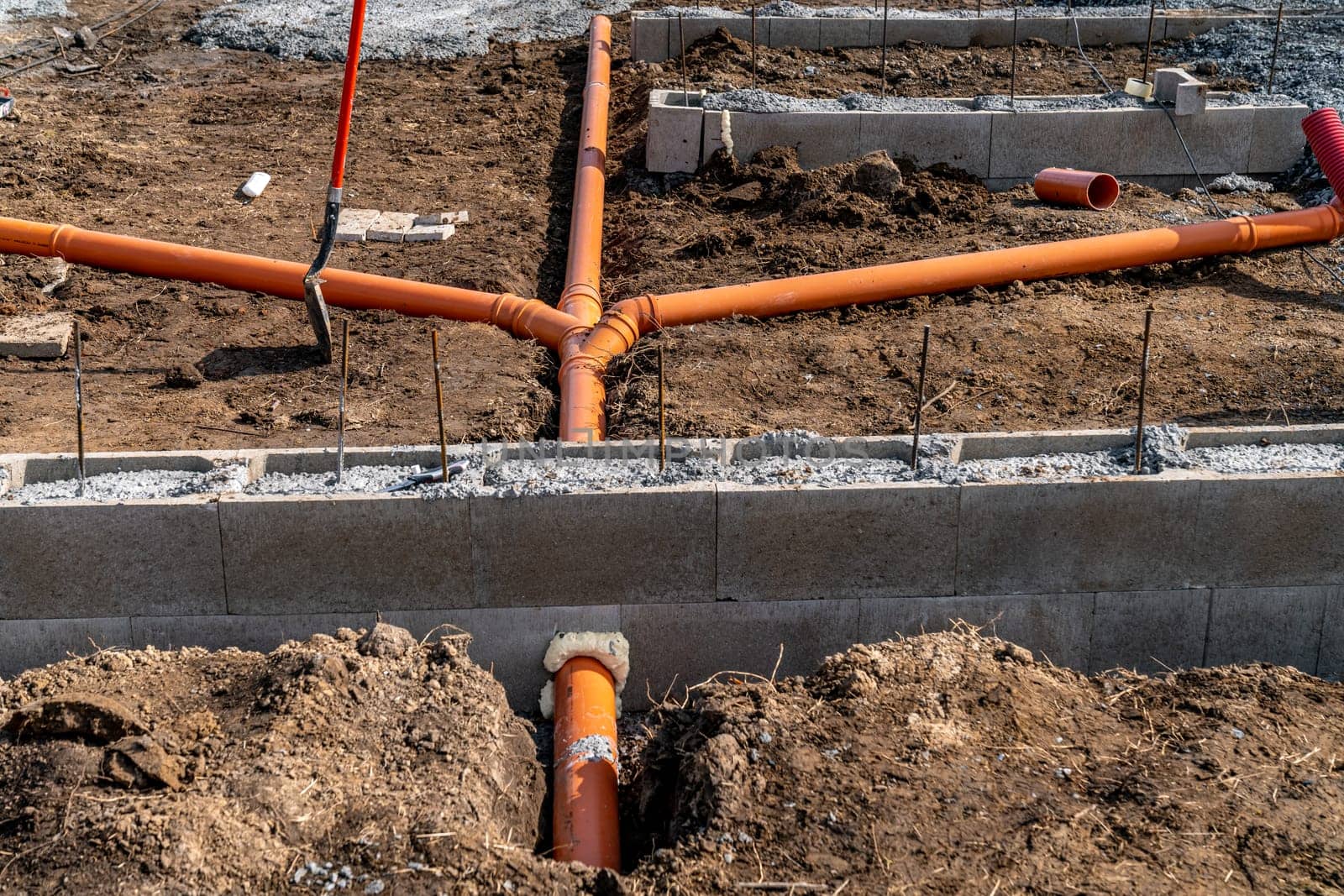 plastic pipe for sewage network in the base plate at the construction site.
