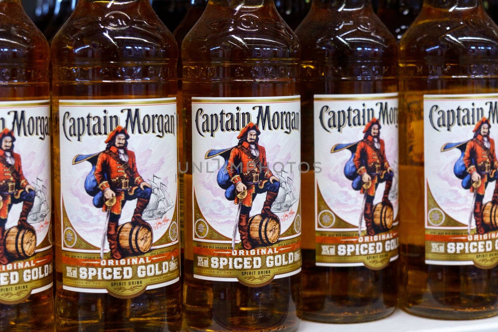 Tyumen, Russia-March 17, 2023: Captain Morgan original spiced gold spirit drink bottles. Sale of alcohol in the supermarket