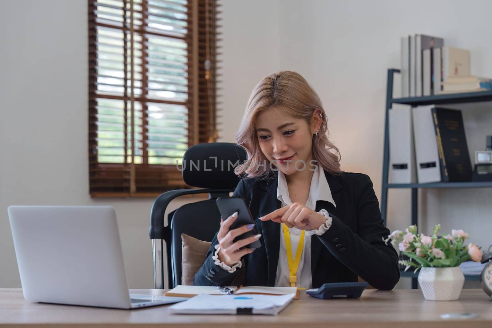 business woman with phone for communication typing while smile happy and relax by nateemee
