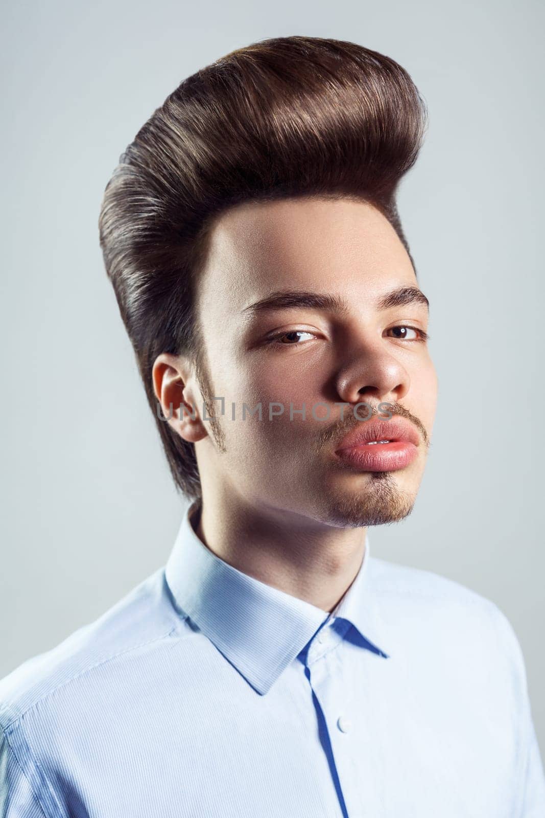 Slelf-confident man with mustache with retro pompadour hairstyle, looking with serious expression. by Khosro1