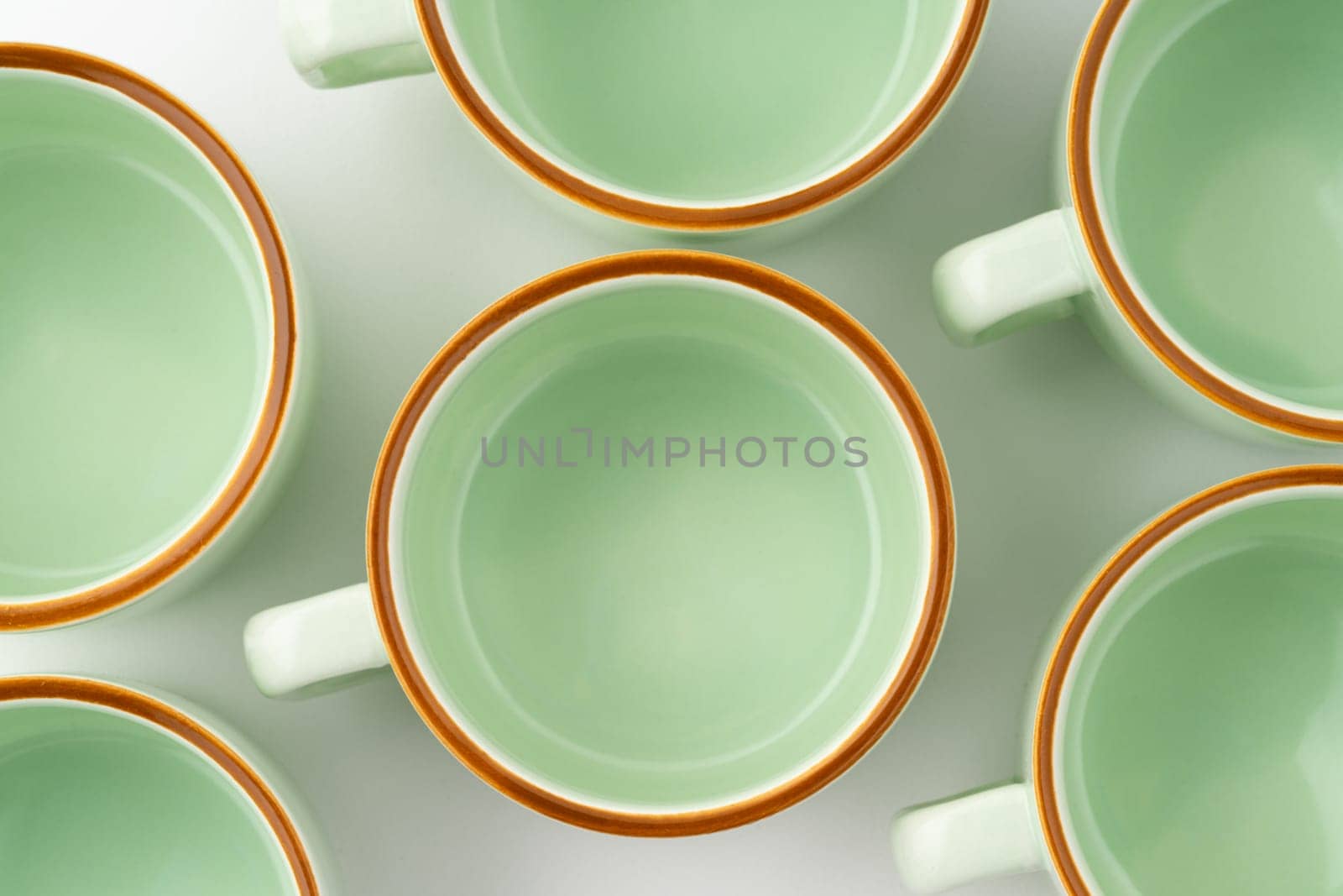 A closeup shot of a set of ceramic kitchen utensils on a white background by A_Karim