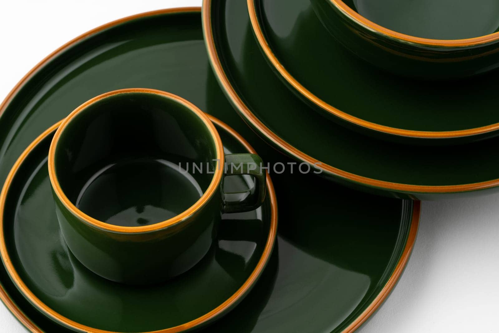 A set of dark green ceramic tableware with orange outlines by A_Karim