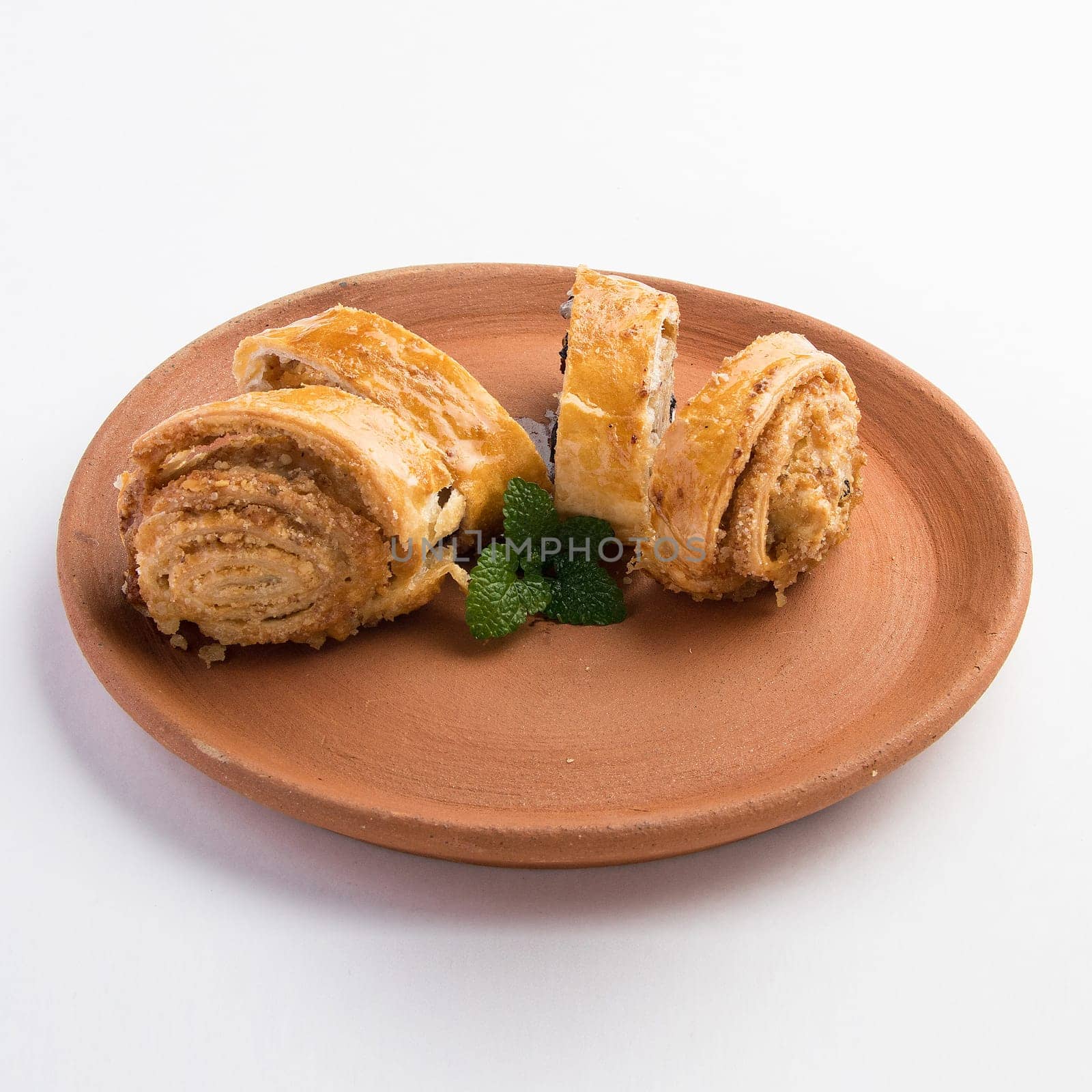 A beautiful shot of tasty sweet rolls with walnuts, raisins and sugar by A_Karim