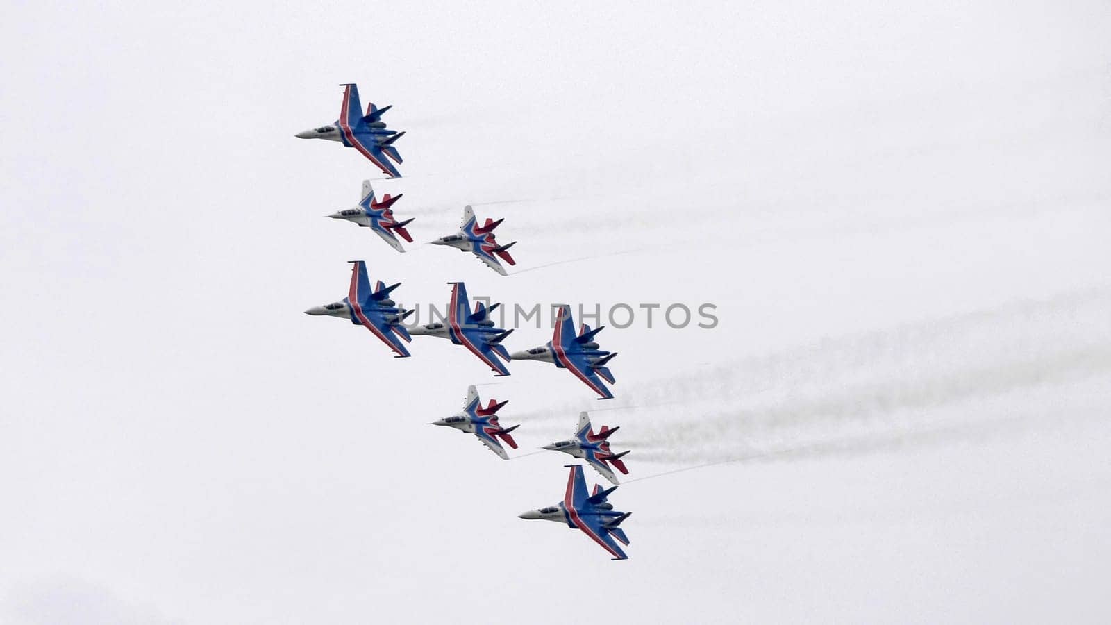 MOSCOW, RUSSIA - MAY 7, 2021: Avia parade in Moscow. group jet fighter aircraft MiG-35 and Su-30 in the sky on parade of Victory in World War II in Moscow, Russia