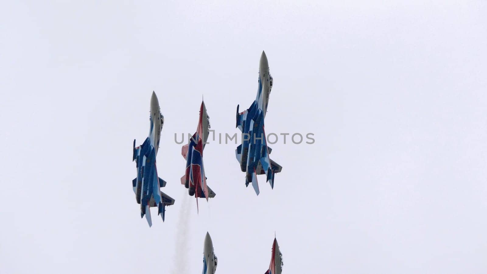 MOSCOW, RUSSIA - MAY 7, 2021: Avia parade in Moscow. group jet fighter aircraft MiG-35 and Su-30 in the sky on parade of Victory in World War II in Moscow, Russia