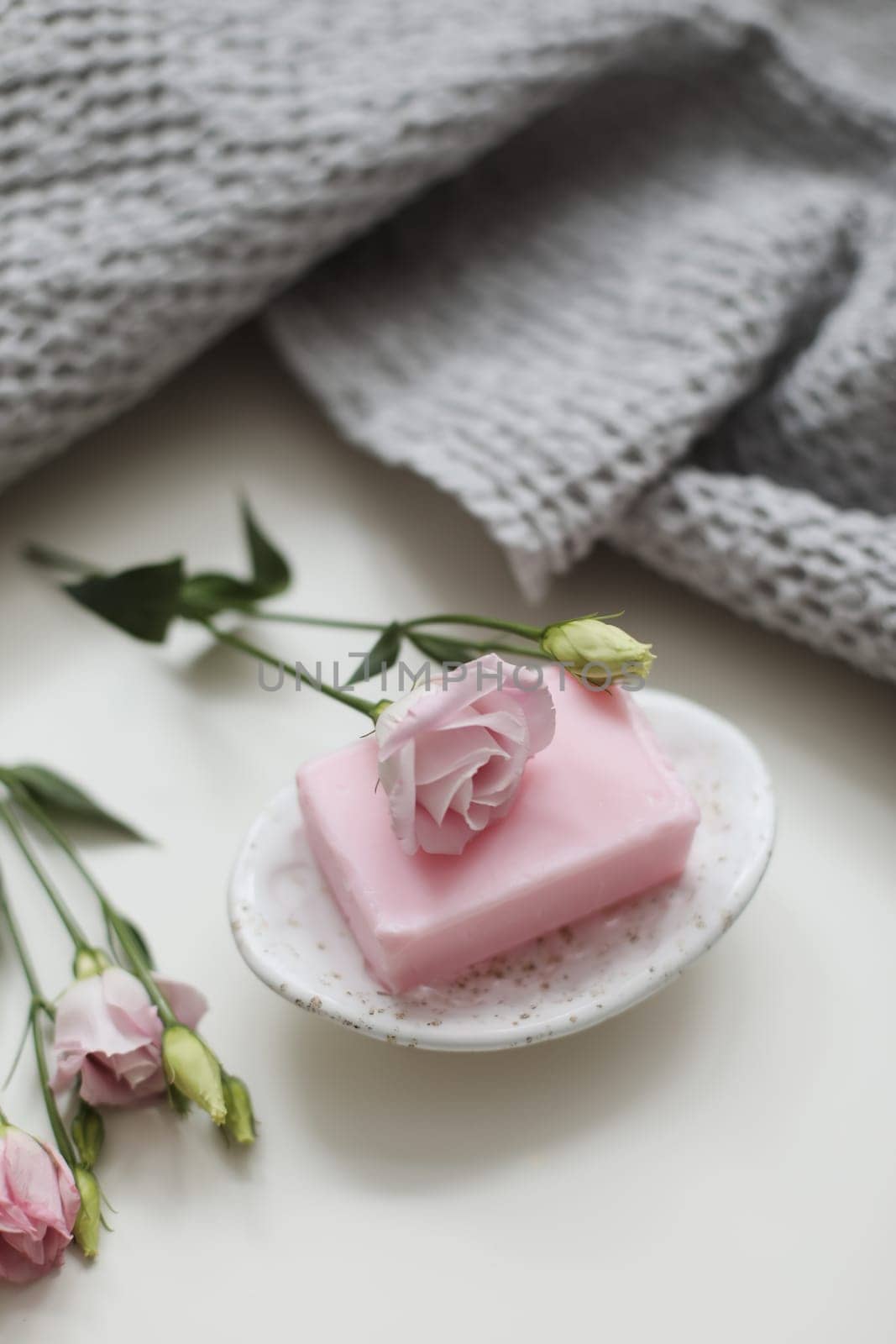 Rose floral handmade soap. Organic cosmetics concept. Natural vegan soap with rose fragrance.