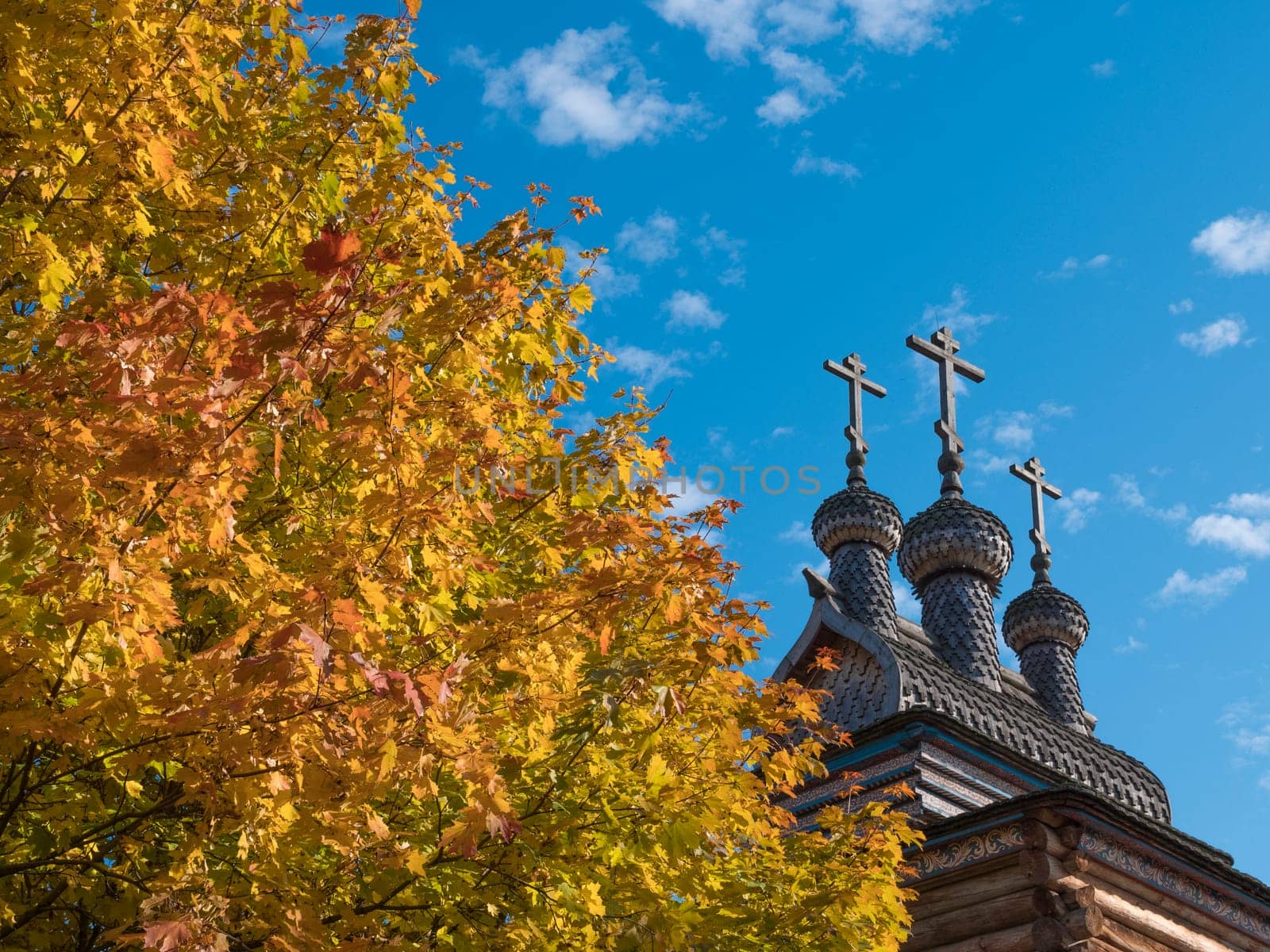 Autumn Landscape with a bell tower of the Church in Russia.