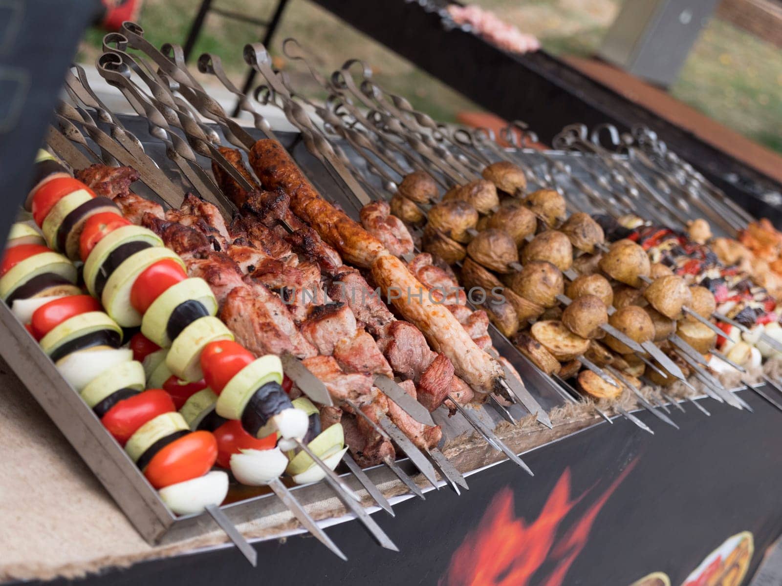 Pork and mutton shashlik on skewers, lulah kebab and lamb ribs served.