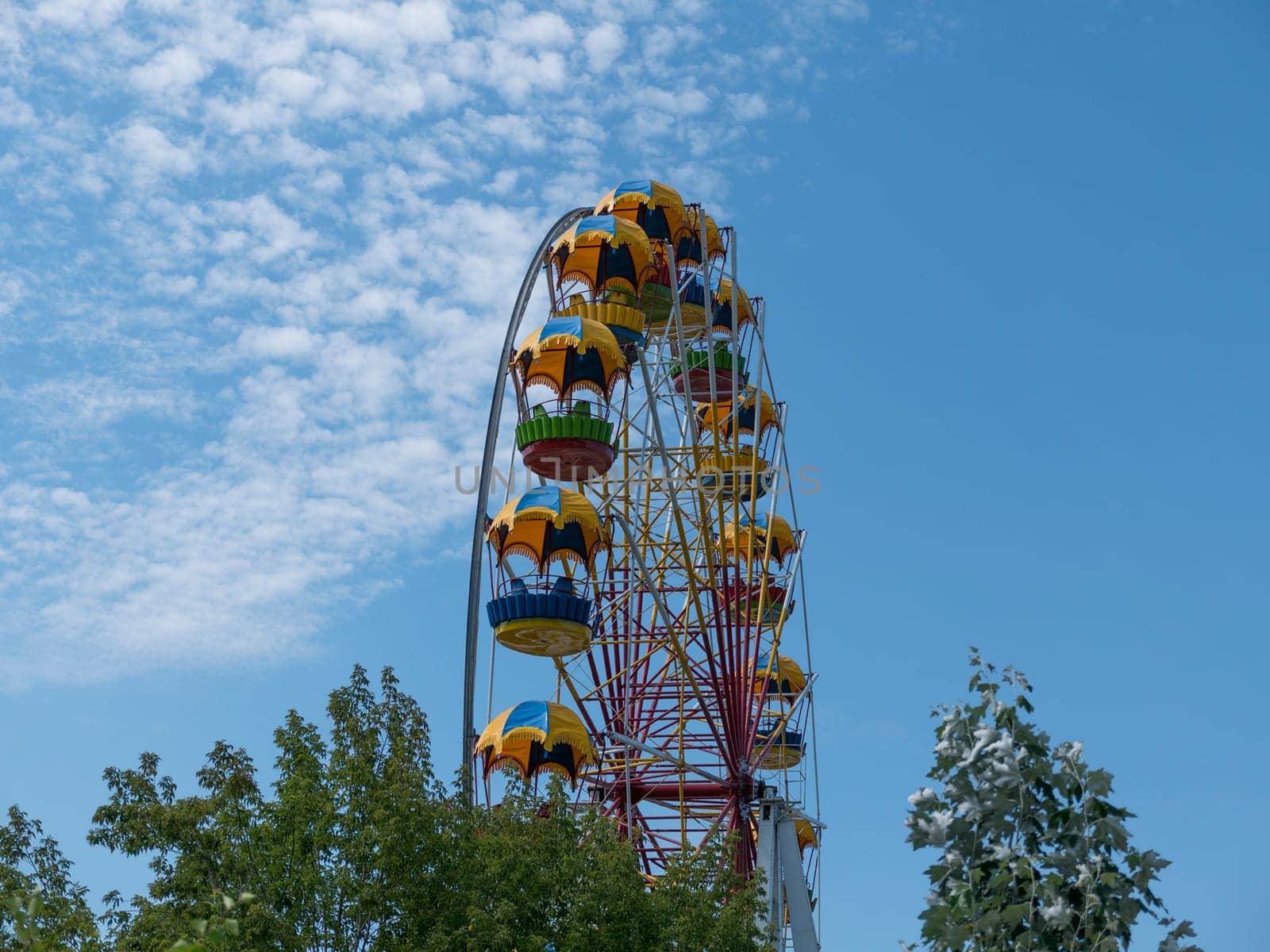 Atraktsion colorful ferris wheel against the sky.