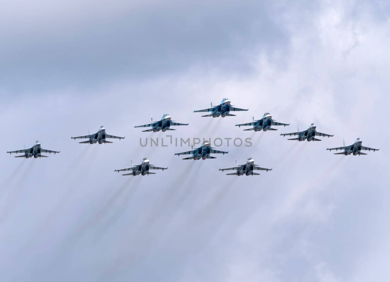 MOSCOW, RUSSIA - MAY 7, 2021: Avia parade in Moscow. su-35 and su-34 and su-30 in the sky on parade of Victory in World War II in Moscow, Russia