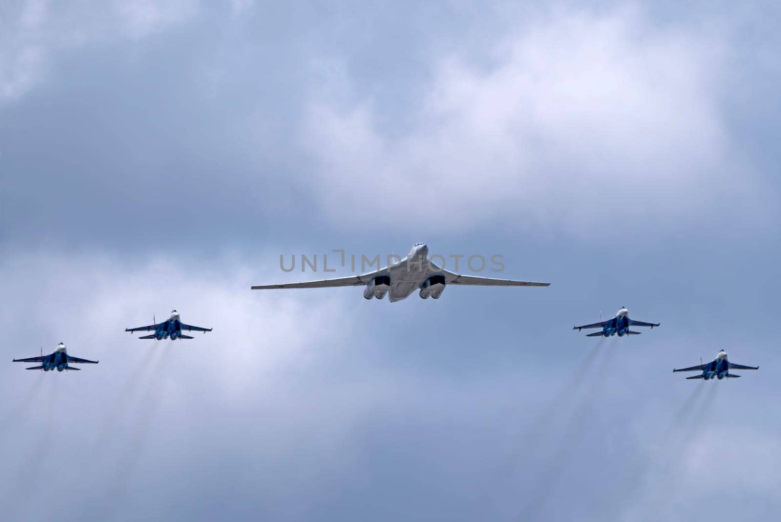 MOSCOW, RUSSIA - MAY 7, 2021: Avia parade in Moscow. su-35 and strategic bomber and missile platform Tu-160 in the sky on parade of Victory in World War II in Moscow, Russia