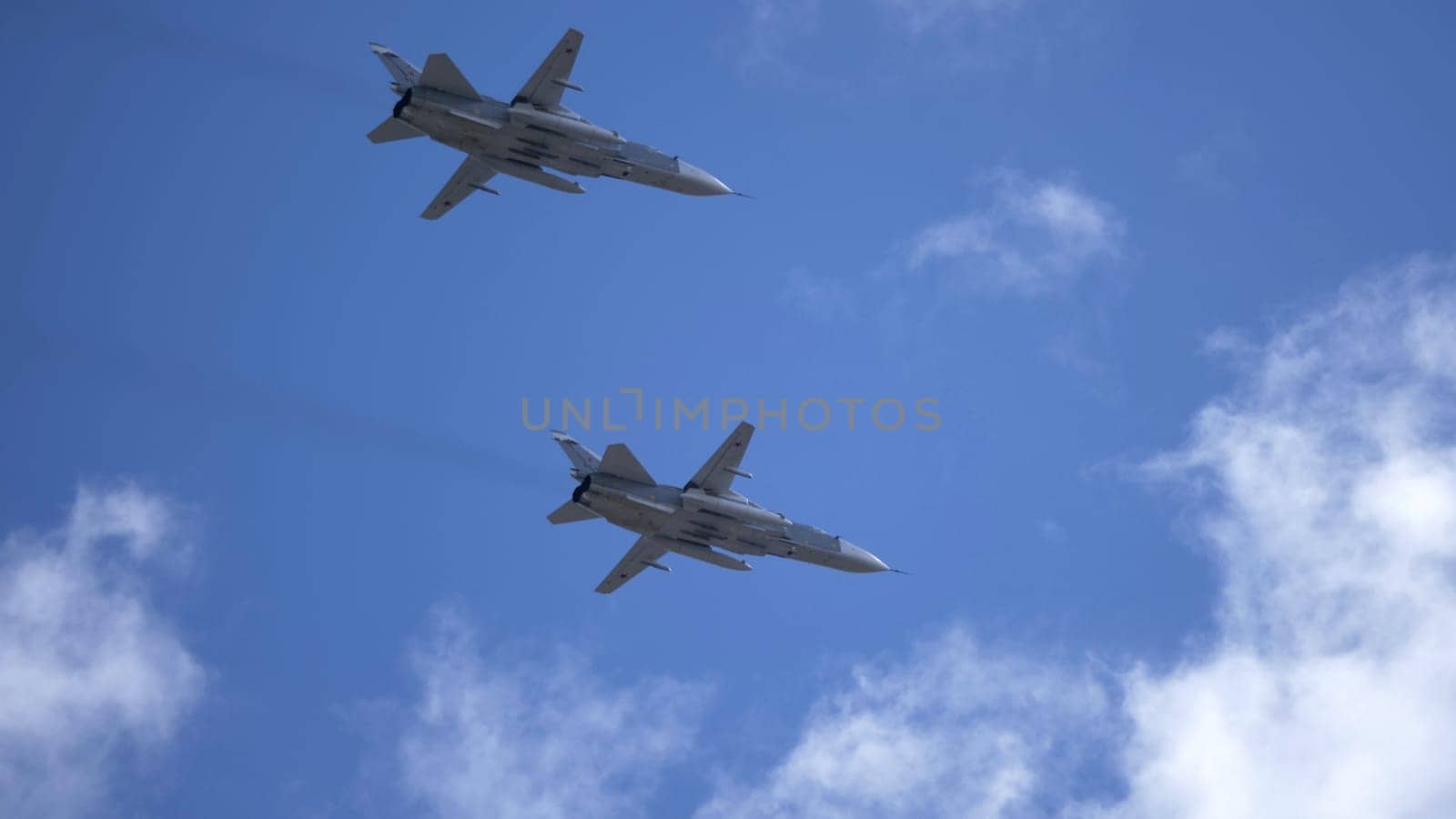 MOSCOW, RUSSIA - MAY 7, 2021: Avia parade in Moscow. jet fighter aircraft Su-24 in the sky on parade of Victory in World War II in Moscow, Russia