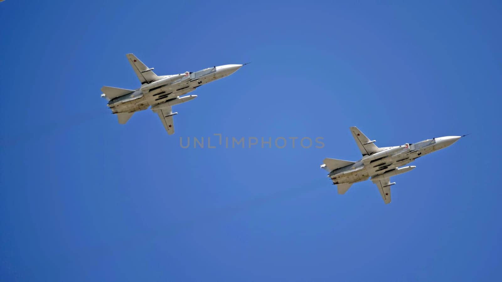 MOSCOW, RUSSIA - MAY 7, 2021: Avia parade in Moscow. jet fighter aircraft Su-24 in the sky on parade of Victory in World War II in Moscow, Russia