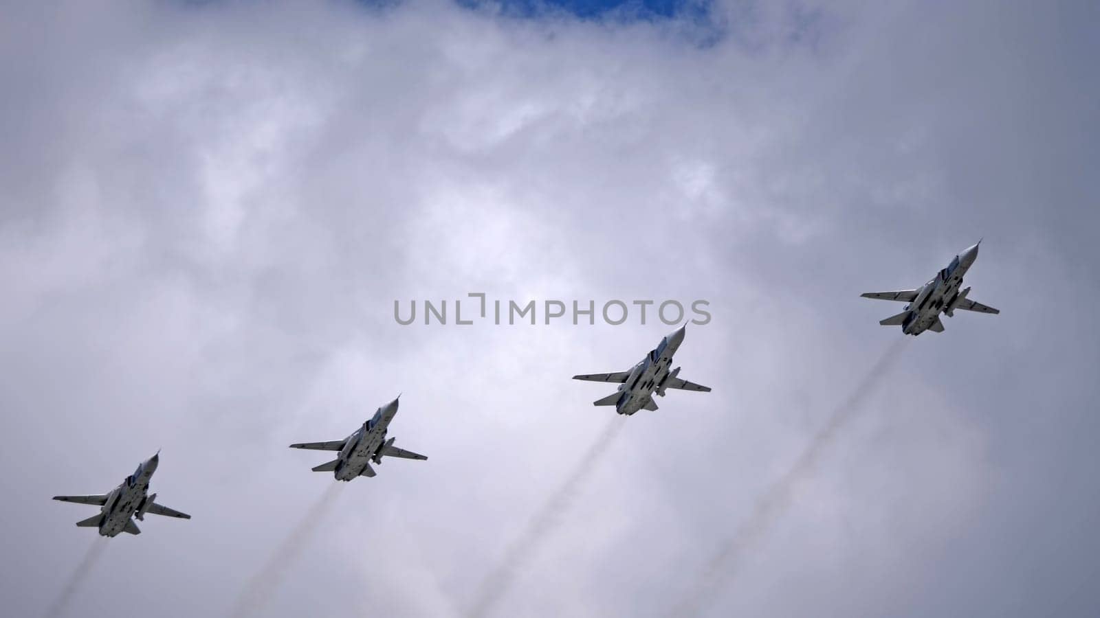 MOSCOW, RUSSIA - MAY 7, 2021: Avia parade in Moscow. jet fighter aircraft Su-24 in the sky on parade of Victory in World War II in Moscow, Russia