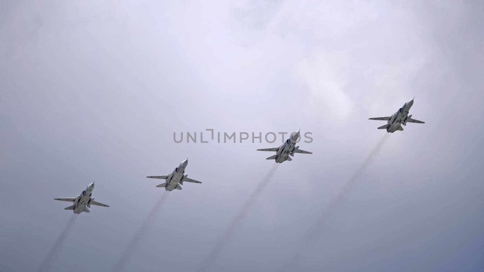 MOSCOW, RUSSIA - MAY 7, 2021: Avia parade in Moscow. jet fighter aircraft Su-24 in the sky on parade of Victory in World War II in Moscow, Russia