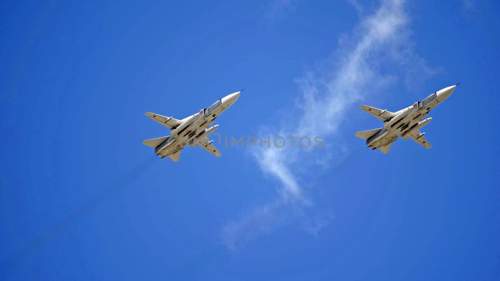 MOSCOW, RUSSIA - MAY 7, 2021: Avia parade in Moscow. jet fighter aircraft Su-24 in the sky on parade of Victory in World War II in Moscow, Russia