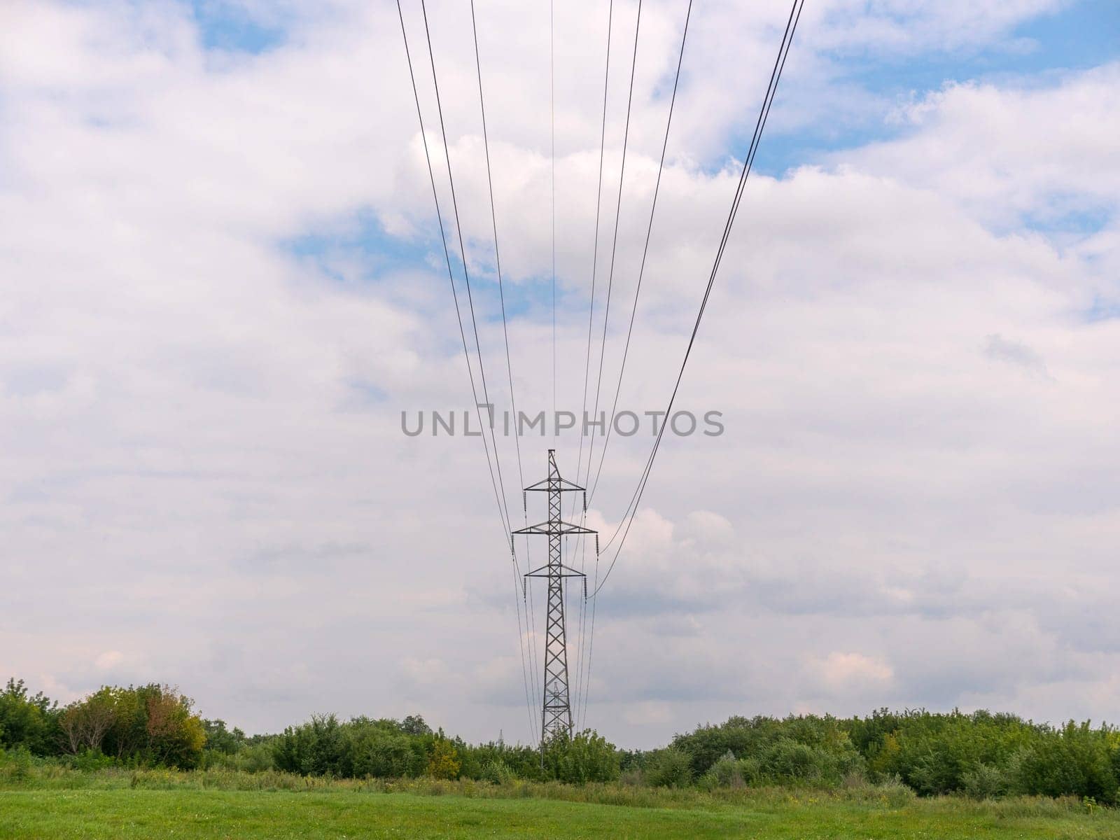 cloudy morning sky and a high-voltage line.