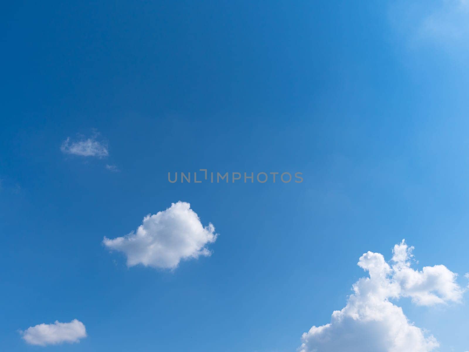 Beautiful blue sky with bright white clouds.