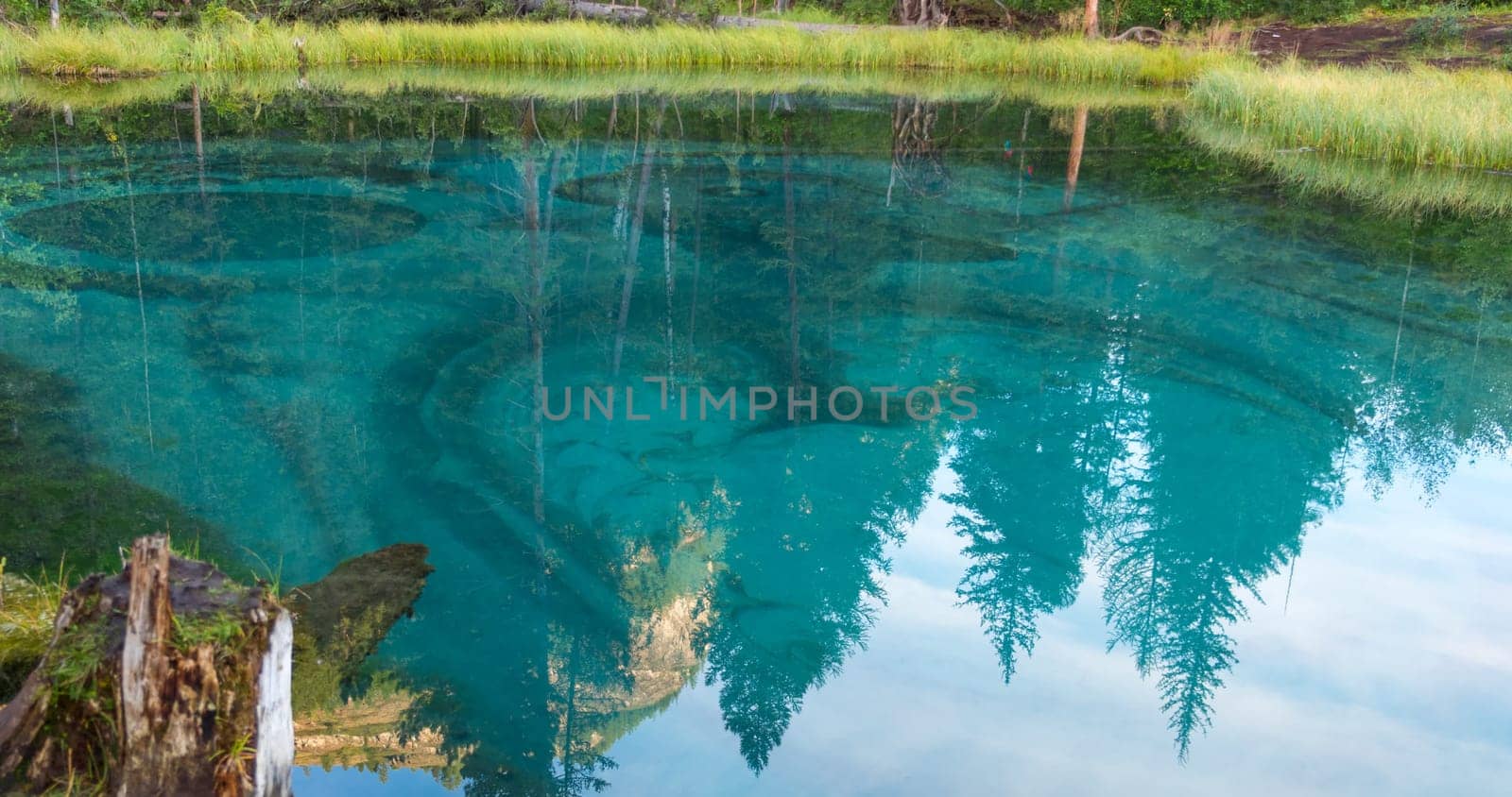 Amazing blue geyser lake in the mountains of Altai, Russia.