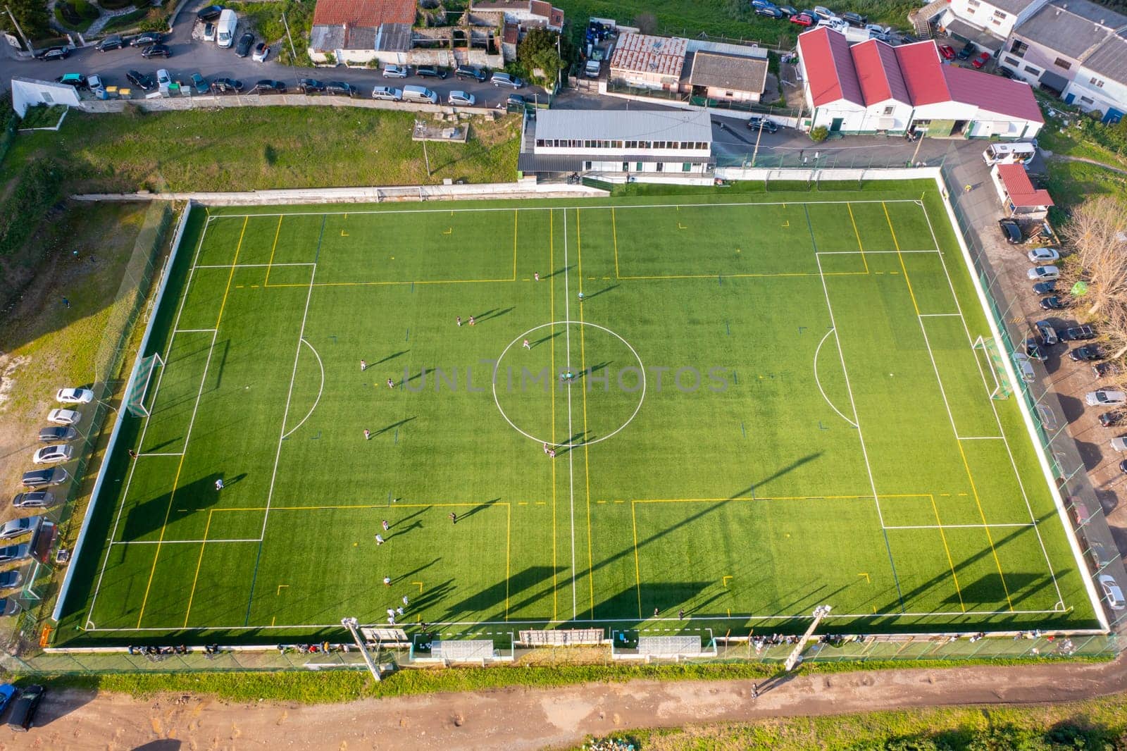 Football field aerial view, public soccer court for training and competition in city.