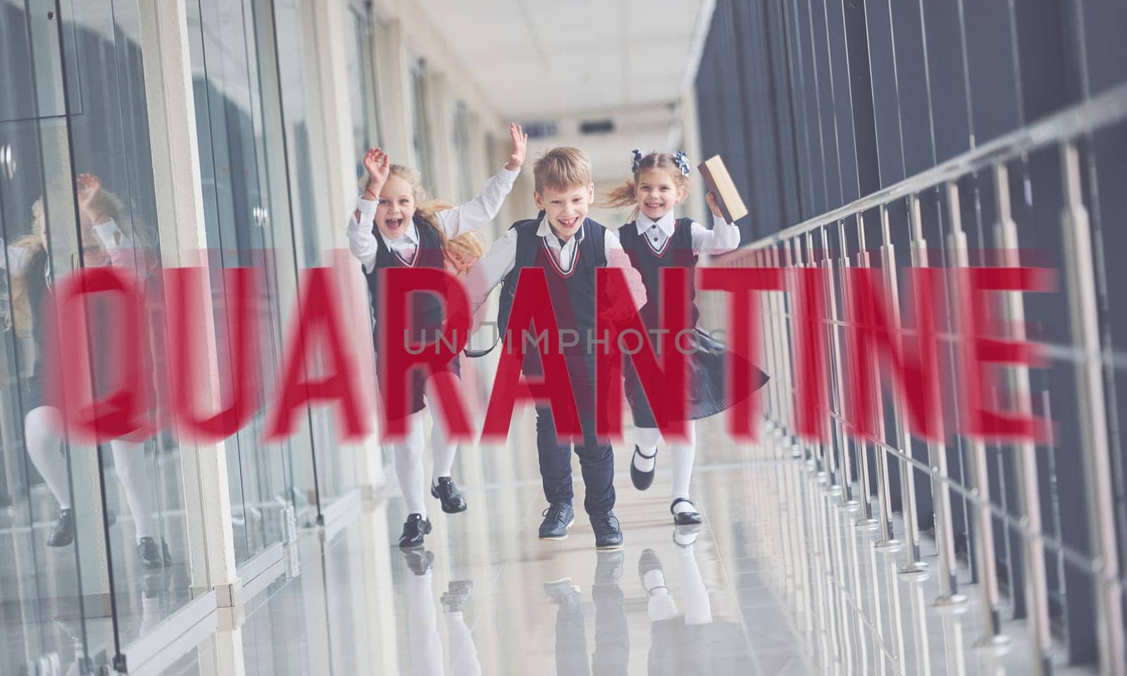 Red quarantine word. Group of kids in school uniform running together indoors.