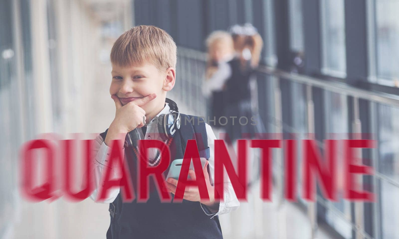 Red quarantine word. Group of kids in school uniform standing together indoors by Standret