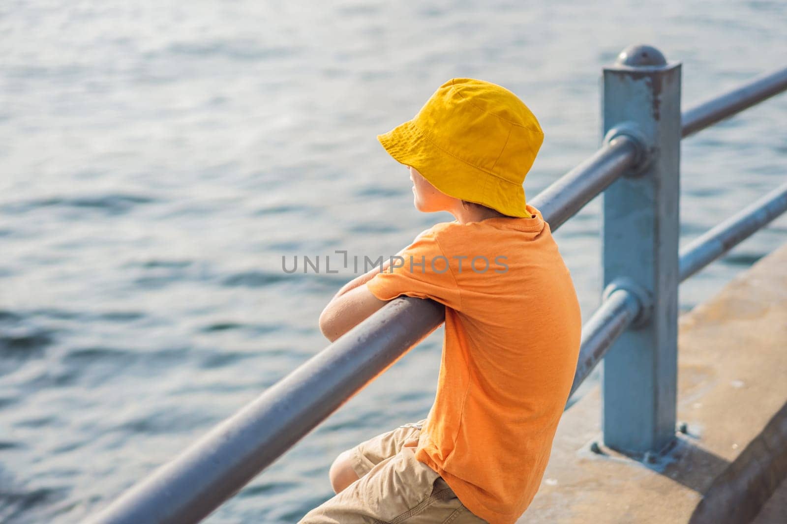 Portrait of Boy tourist with view of Golden Horn Bay, Istanbul, Turkey. Turkiye. Traveling with kids concept.