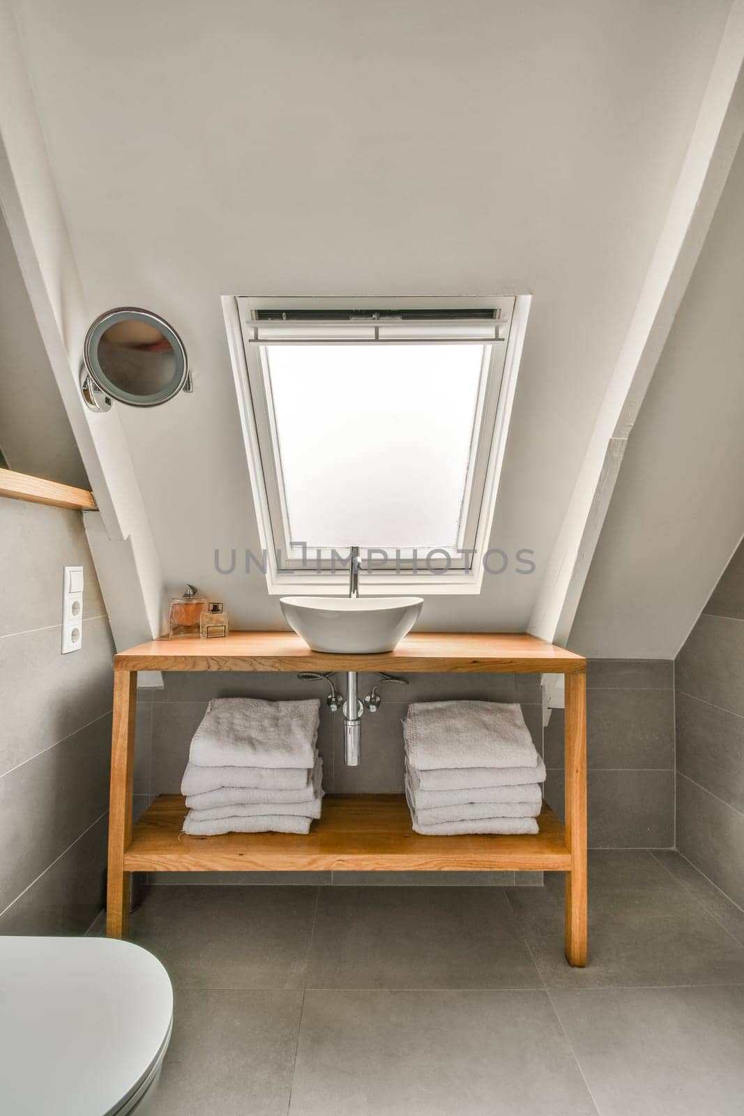 a small bathroom with a sink and a window by casamedia