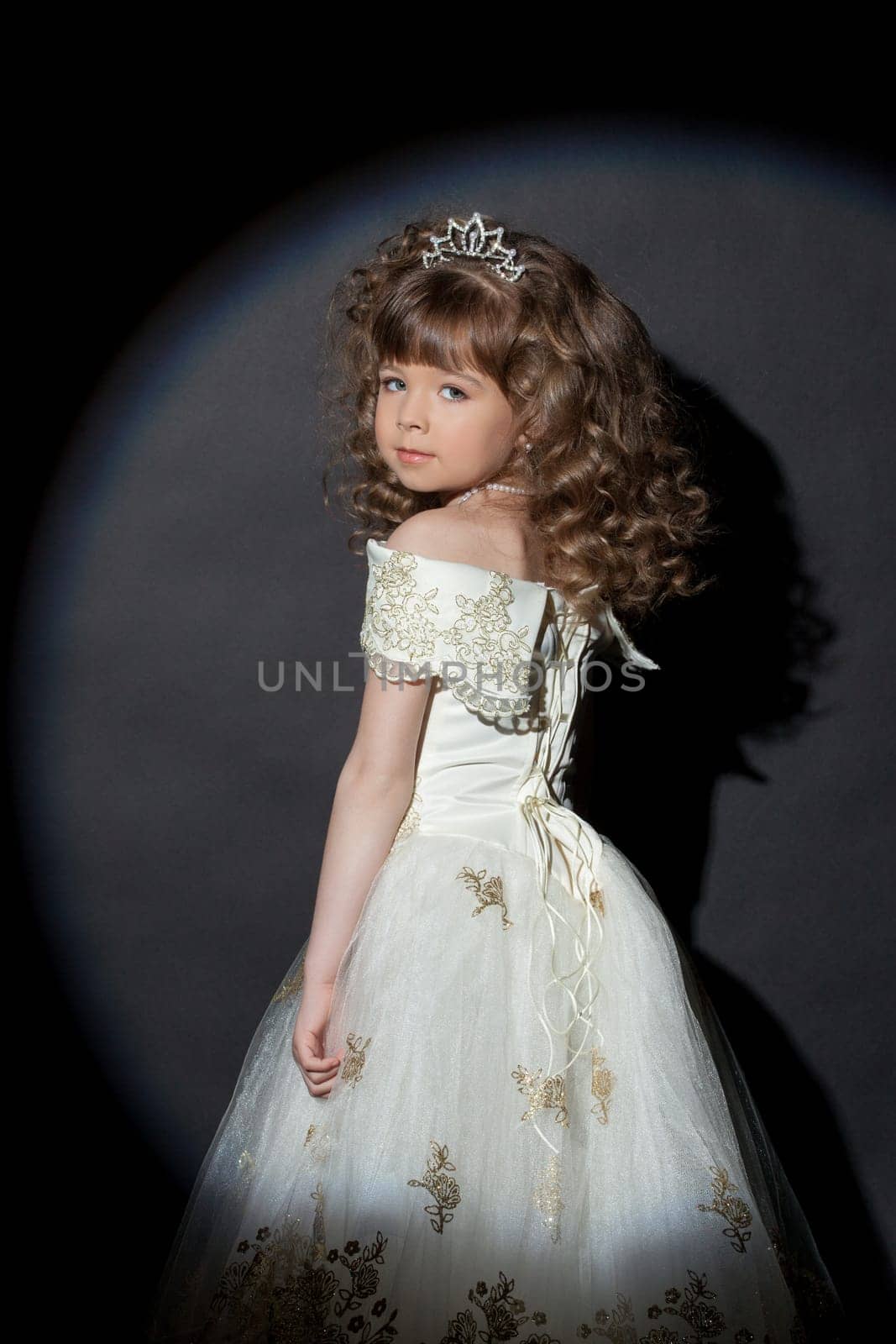 Portrait of adorable little princess with crown, close-up