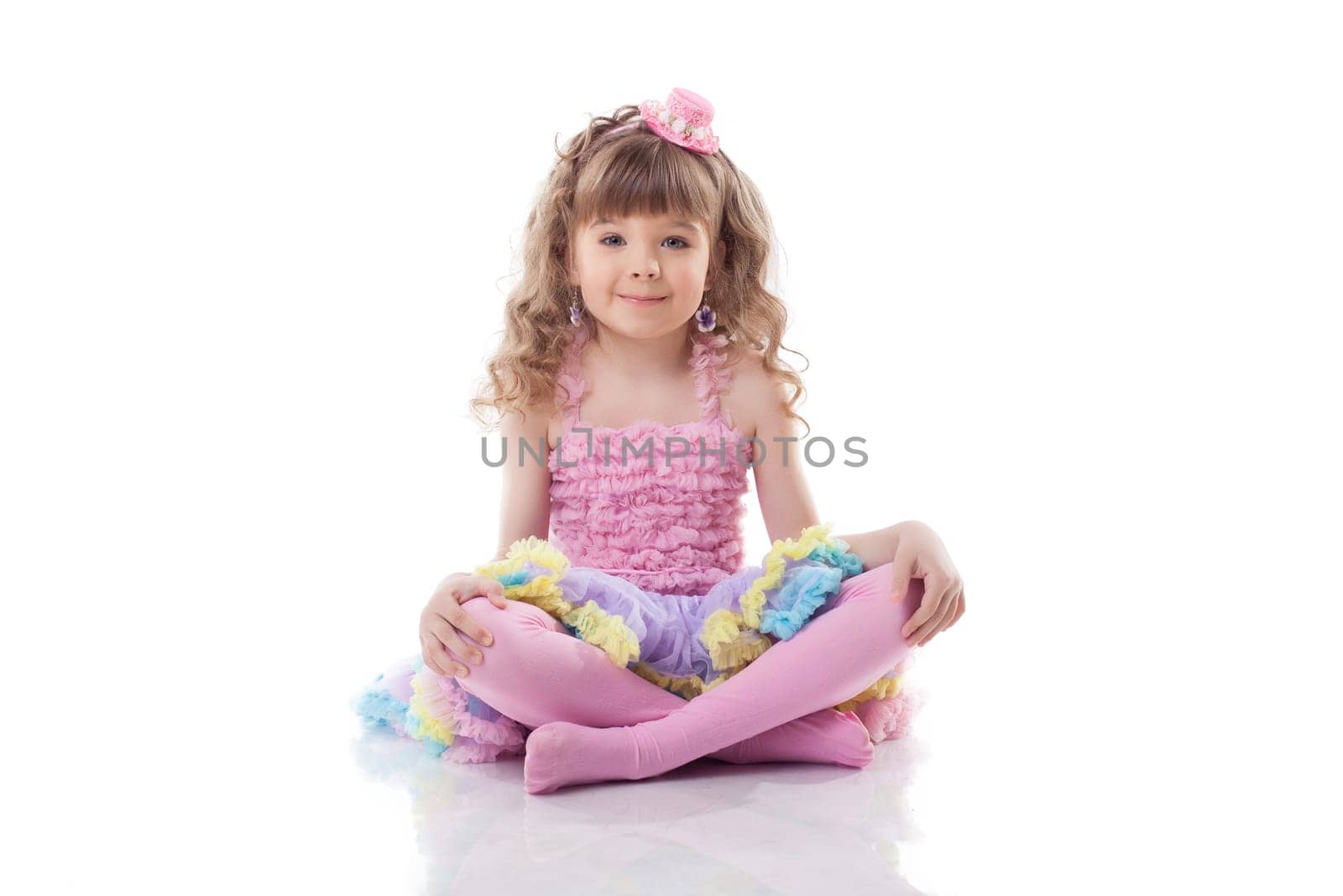 Image of cute little girl posing in candy costume, isolated on white