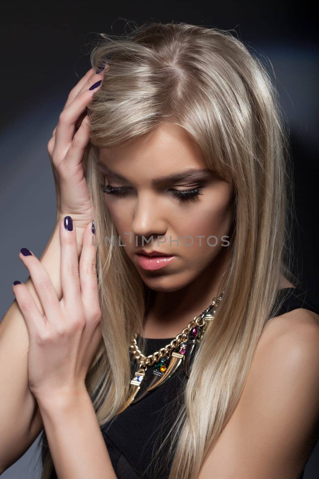 Portrait of gorgeous sad blonde with long hair, close-up
