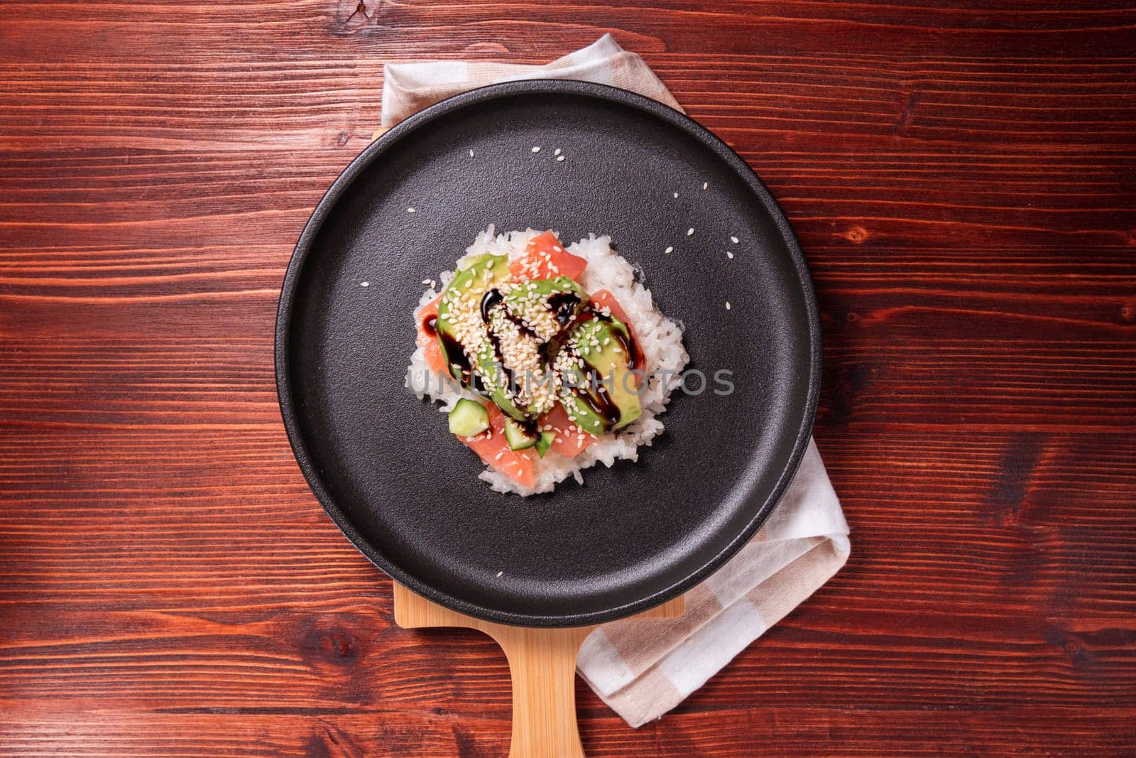 Sushi Waffles food trend, made with a crispy rice waffle and topped off with salmon, cucumber, and avocado. Flat lay
