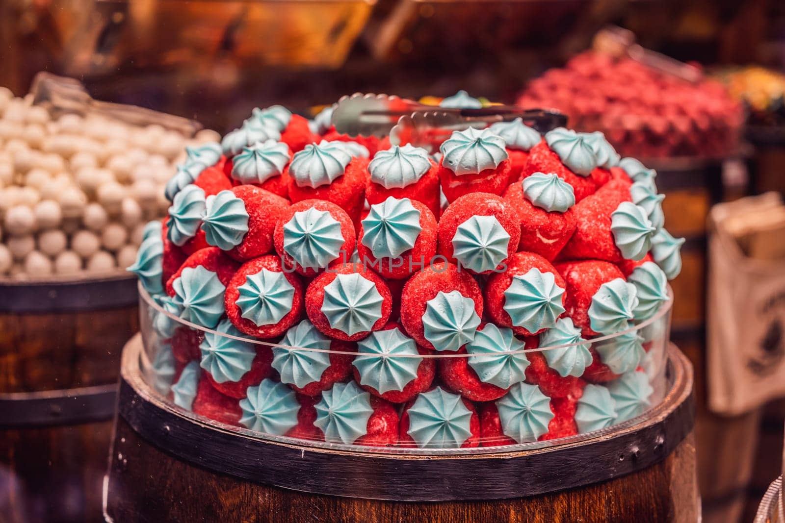 Traditional oriental sweet pastry cookies, nuts, dried fruits, pastilles, marmalade, Turkish desert with sugar, honey and pistachio, in display at a street food market.