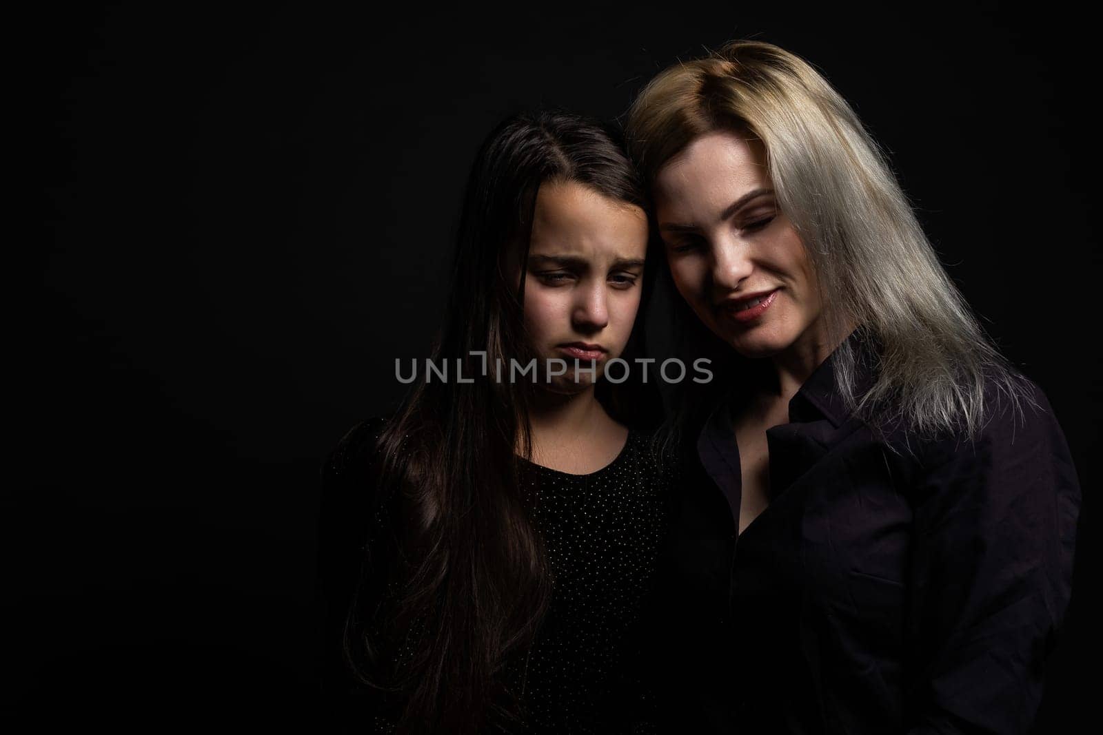 Little girl hugs her mother