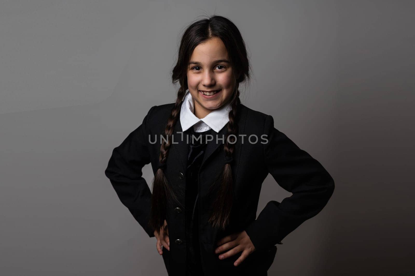 Halloween. A girl in a suit. Holiday. Hallowmas. Wednesday Addams. The Addams Family. Reincarnation. Cosplay. Idea for Halloween. Portrait of a girl