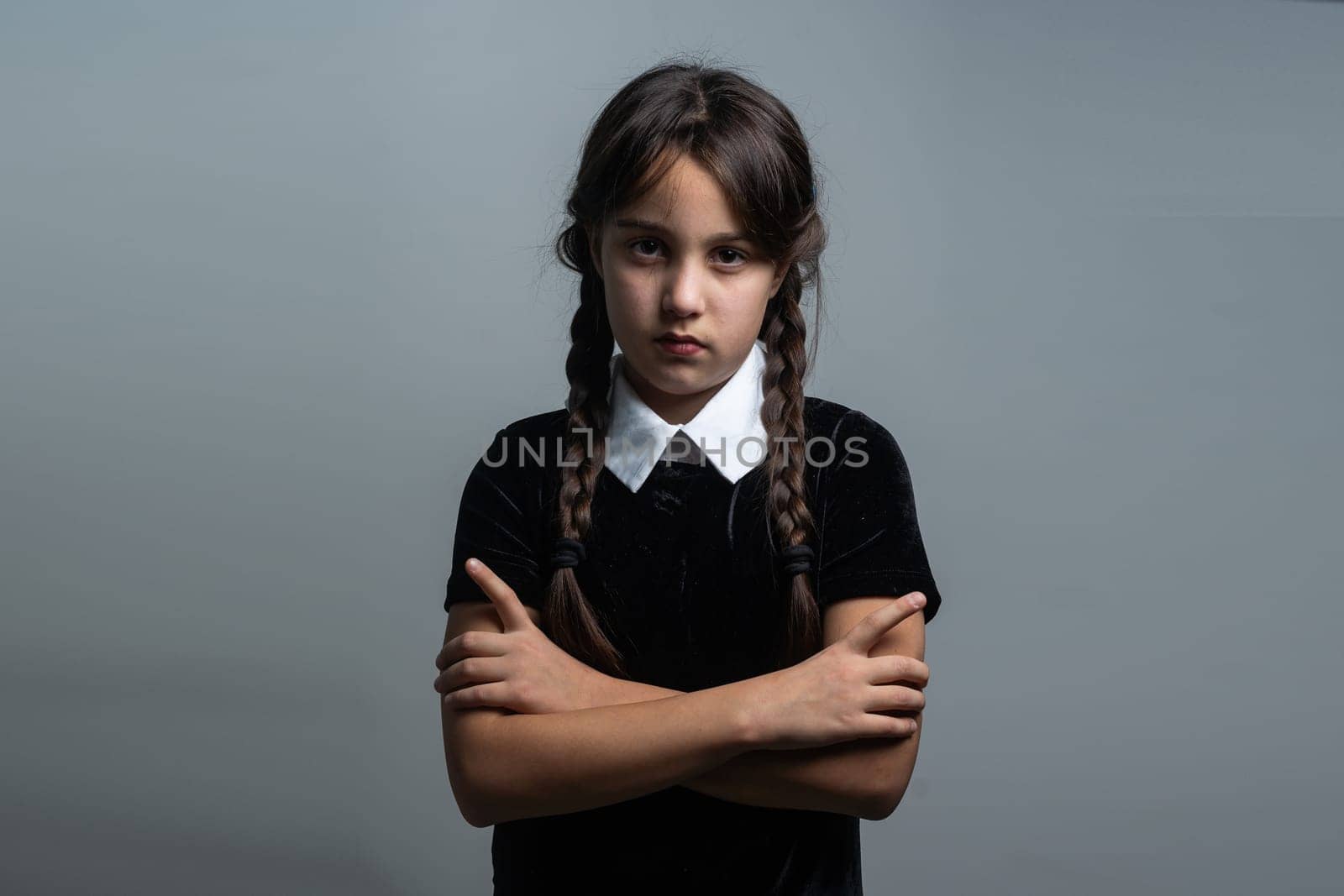 a girl in a Wednesday Addams costume style.