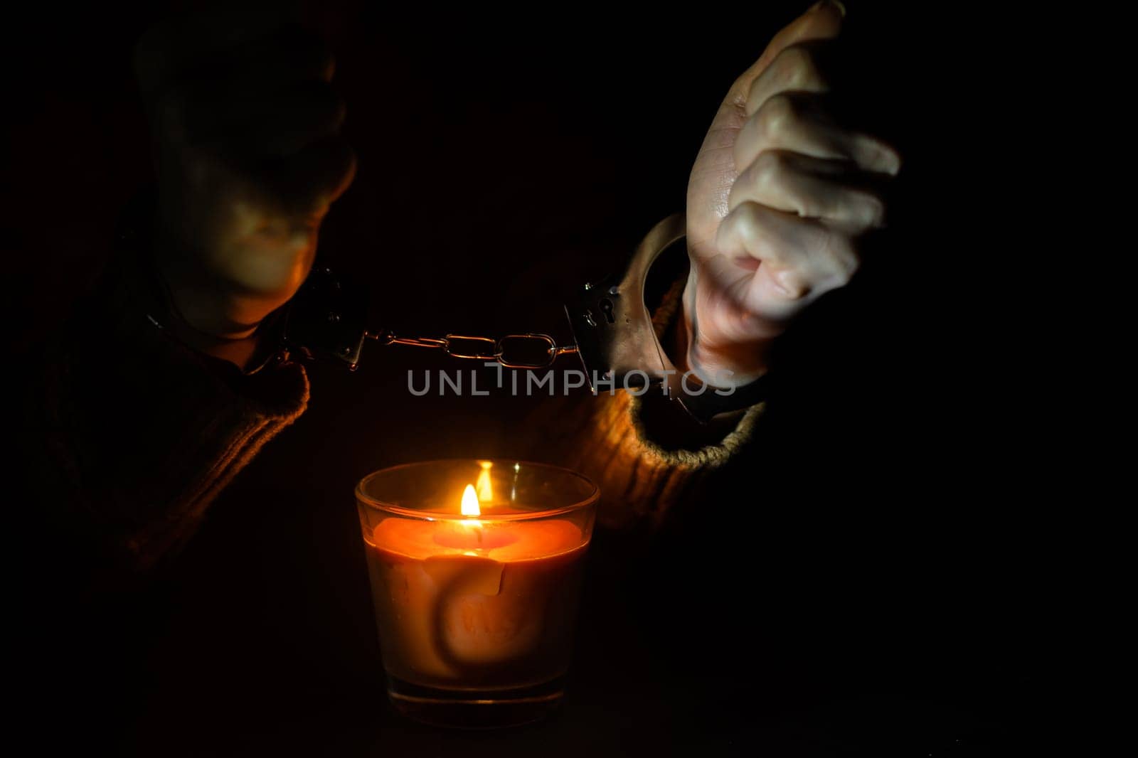 composition with the toy handcuffs, candle. by Andelov13
