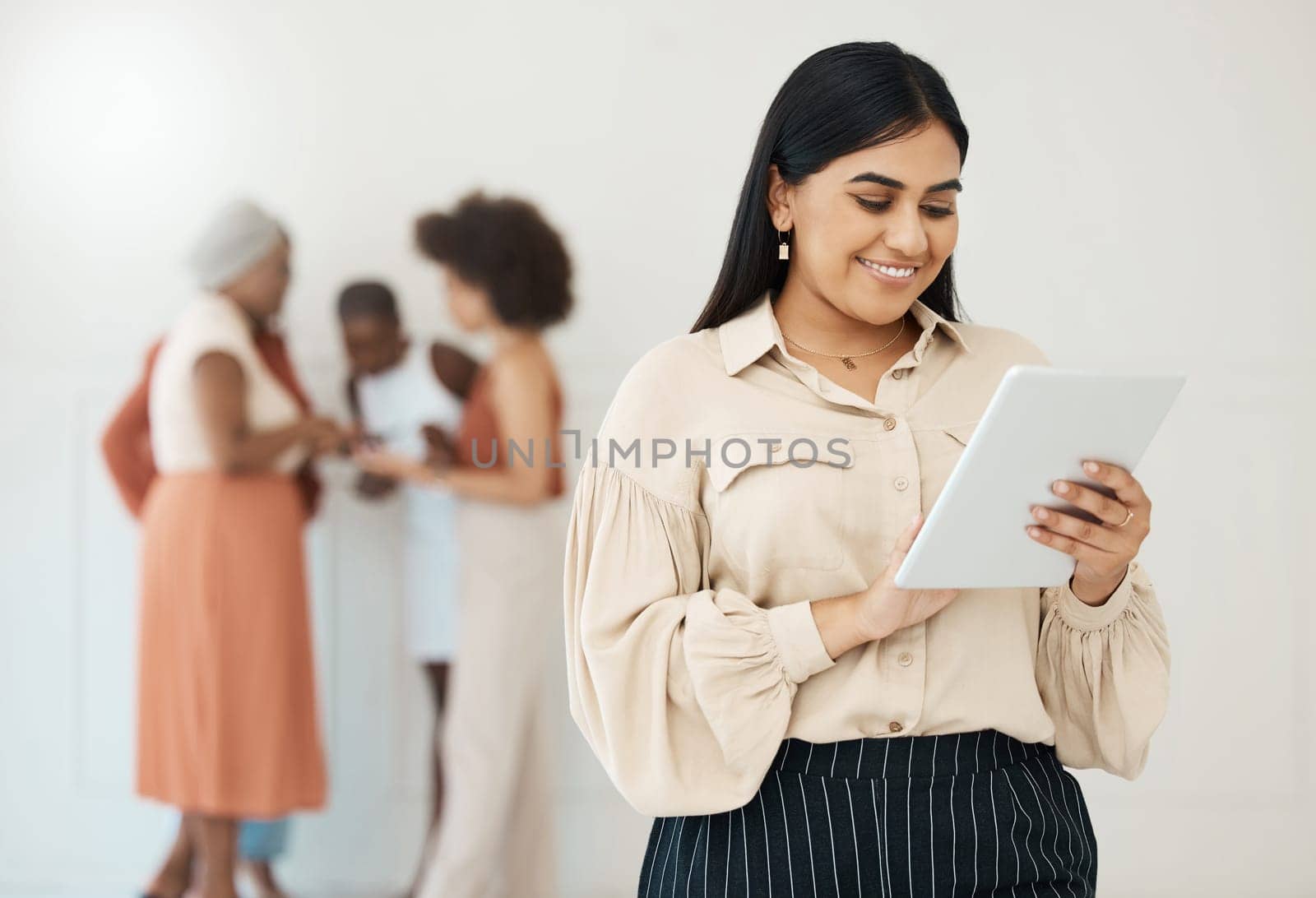 Business woman, tablet and typing online with a smile for communication, internet and network. Happy female entrepreneur working on touch screen for social media, leadership report or search.