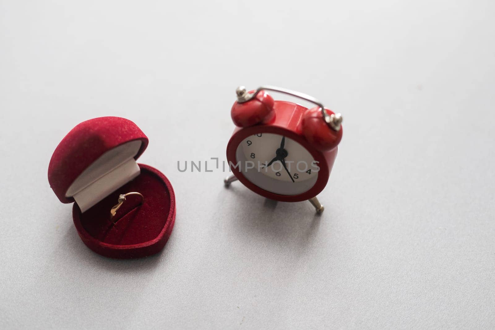 Wedding rings and alarm clock, wedding time concept