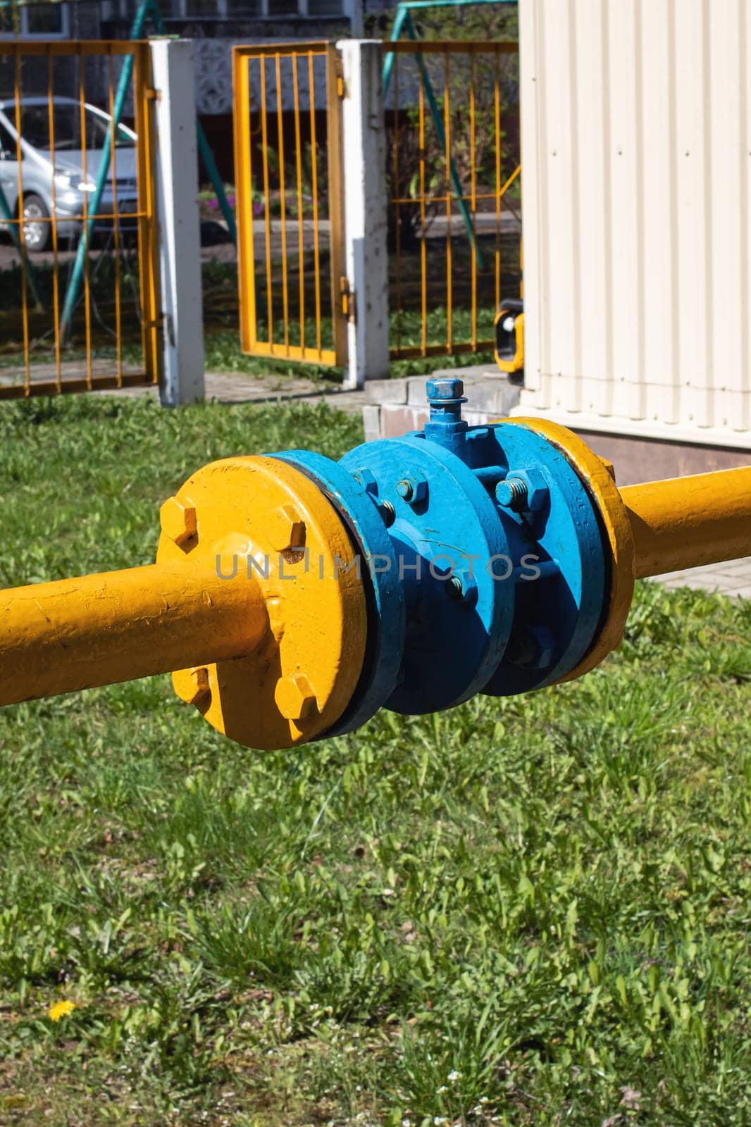 Yellow gas pipe connector system close up outdoor
